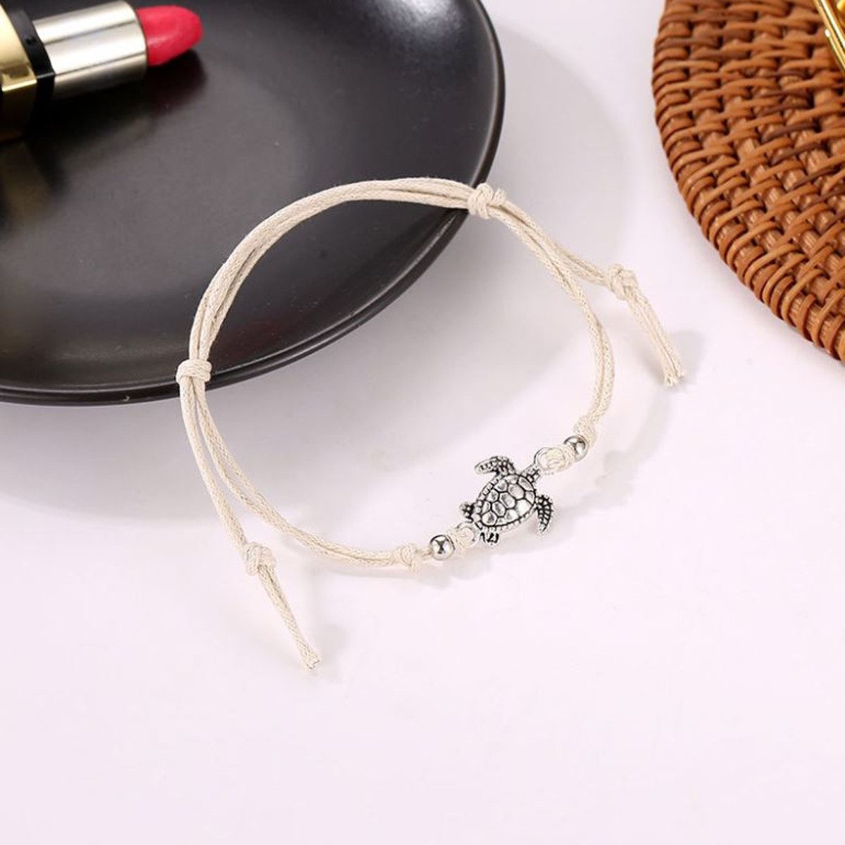 KARMA Fußkette Schildkröte Beige, Schwarz od. günstig online kaufen