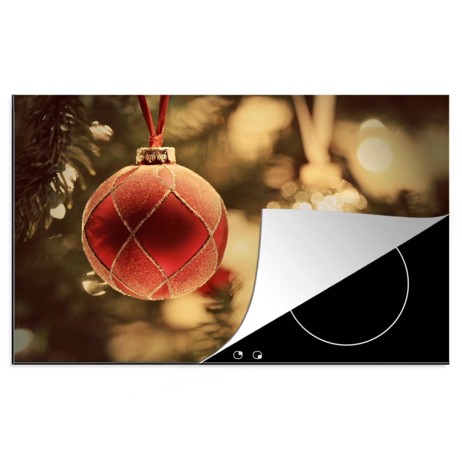 MuchoWow Herdblende-/Abdeckplatte Eine Nahaufnahme von dekorativem Weihnachtsschmuck in der Nähe eines, Vinyl, (1 tlg), 81x52 cm, Induktionskochfeld Schutz für die küche, Ceranfeldabdeckung