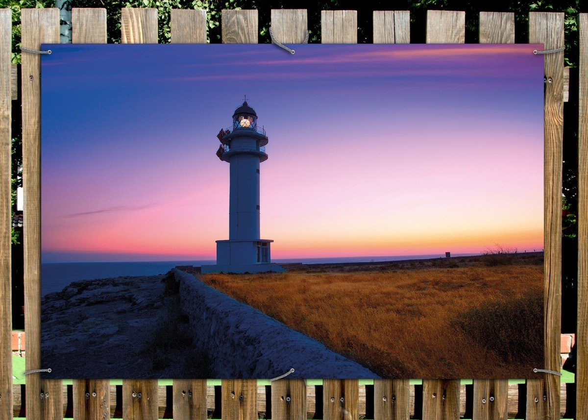 Thumbnail - Wallario Sichtschutzzaunmatten Leuchtturm am Abend auf den Balearen Malerischer Himmel