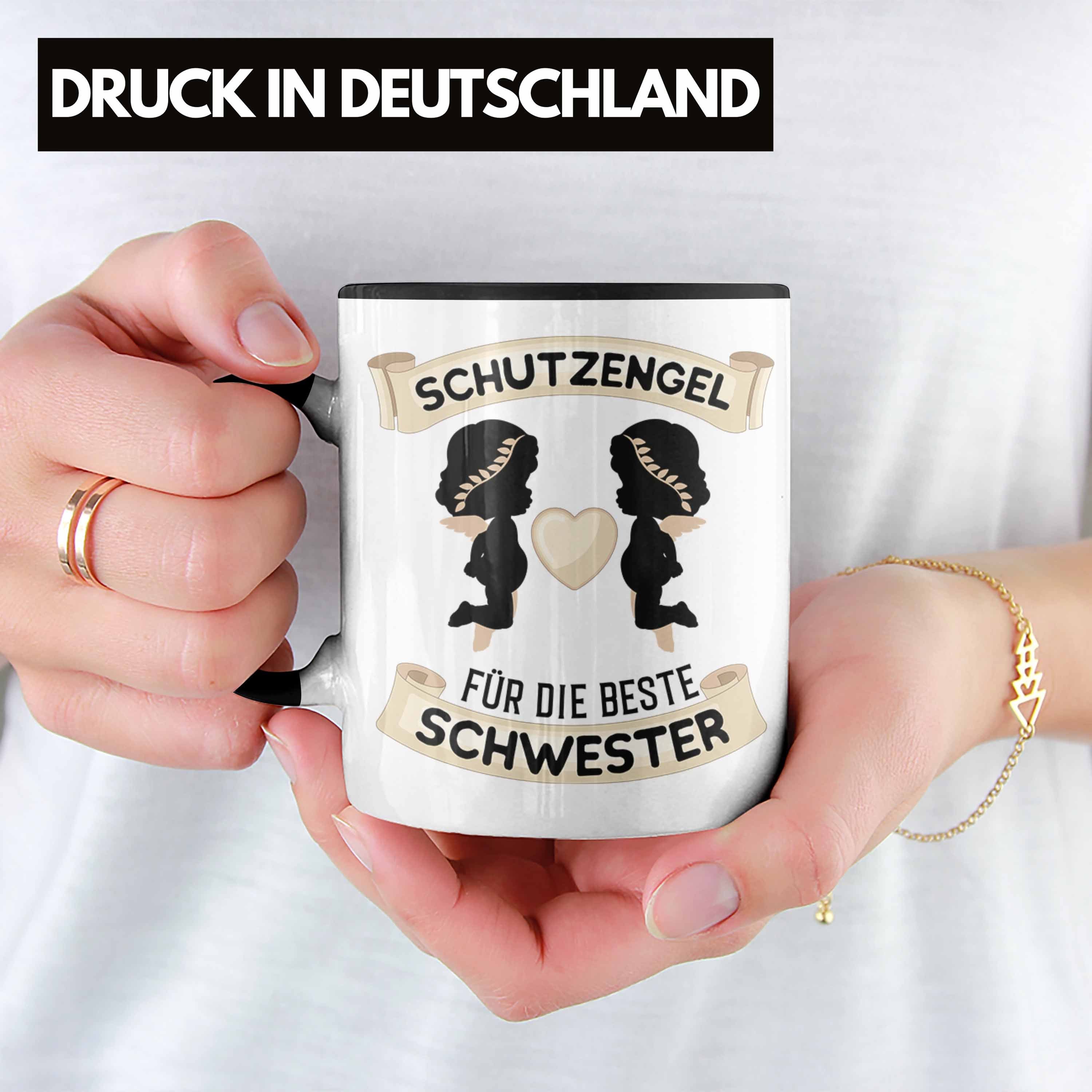 Trendation Tasse Trendation - Schutzengel Beste Schwester Schwester Tasse Geburtstag Schwarz für Geschenk Geschenkidee Schwester