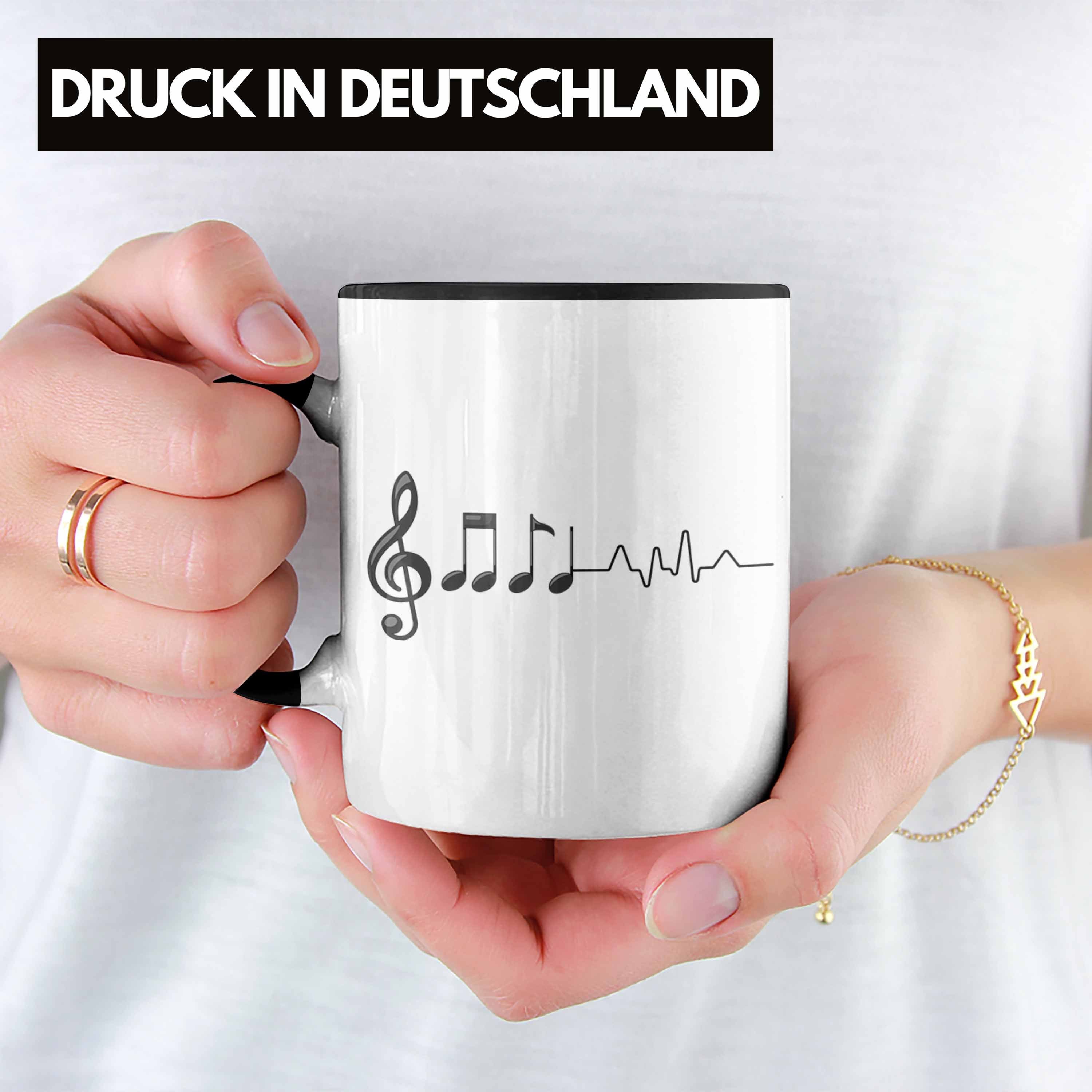 Trendation Tasse Trendation - Musik-Lehrer Musiker Spruch Geschenk Musik-Lehererin Geschenkidee Fan Schwarz Musik Geschenke Tasse Herzschlag