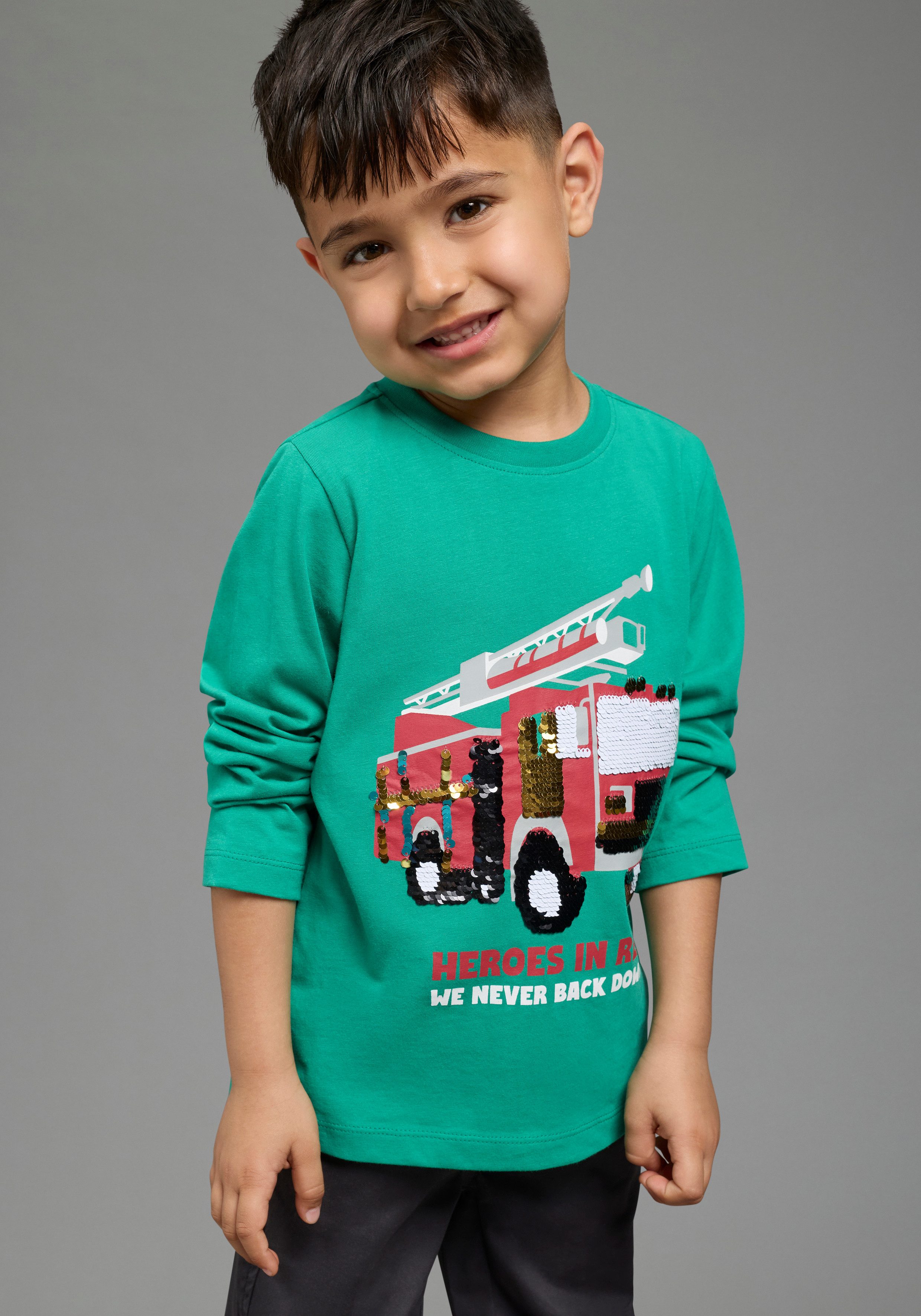 KIDSWORLD Langarmshirt Feuerwehr Pailletten Shirt Shirt mit Feuerwehr Wende-Pailletten