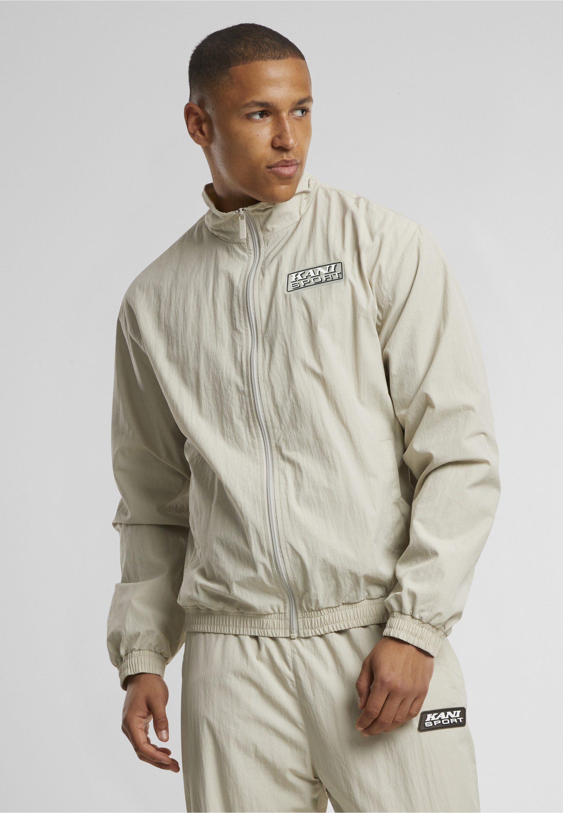 Karl Kani Trainingsjacke Karl Kani Sport Patch Essential Trackjacket (1-St)