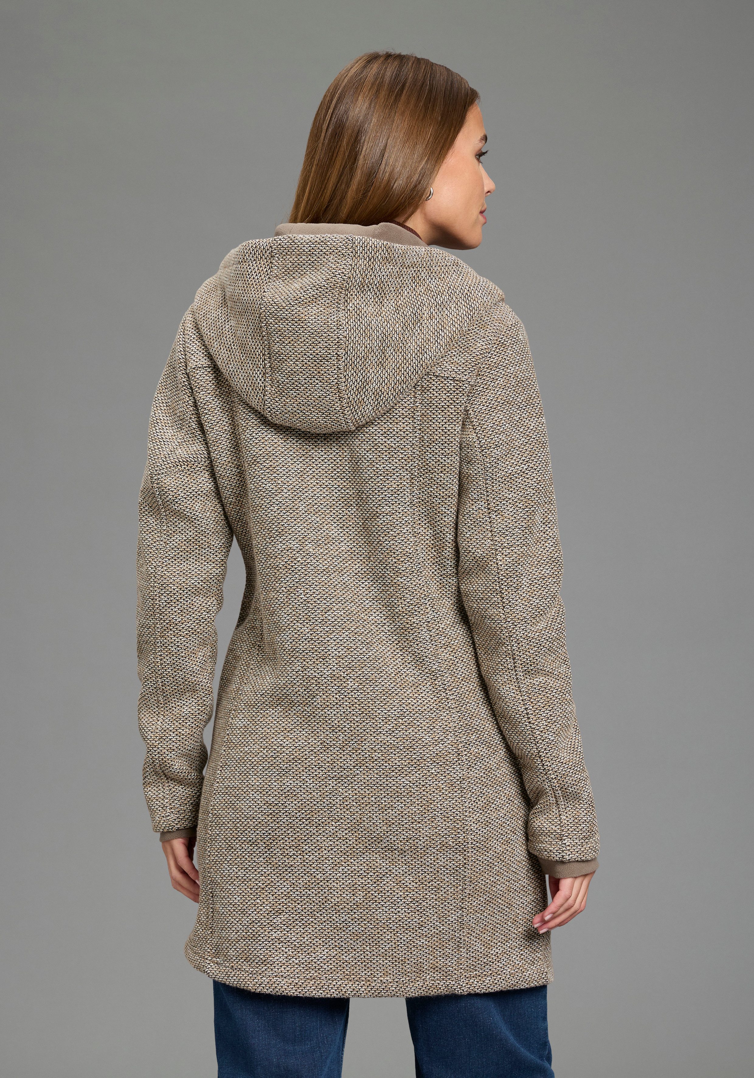 Polarino Strickmantel atmungsaktiv und wärmeisolierend. Strickoptik außen, Fleece innen.