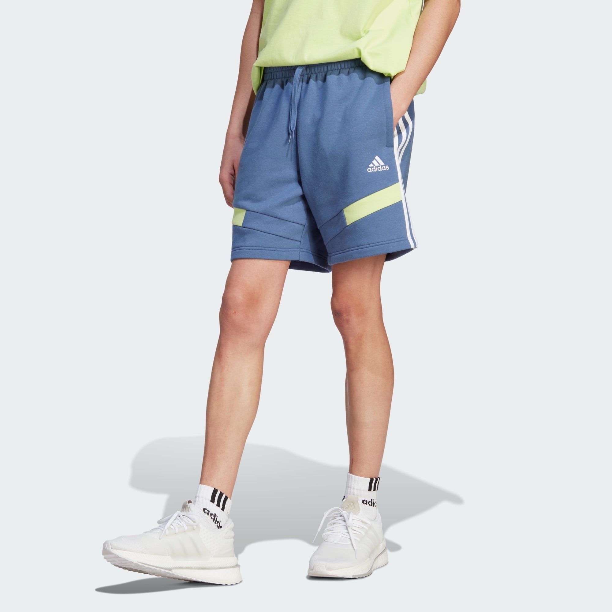 192 cm Sportswear Model trägt Dieses Shorts und (1-tlg), groß adidas Größe ist COLORBLOCK