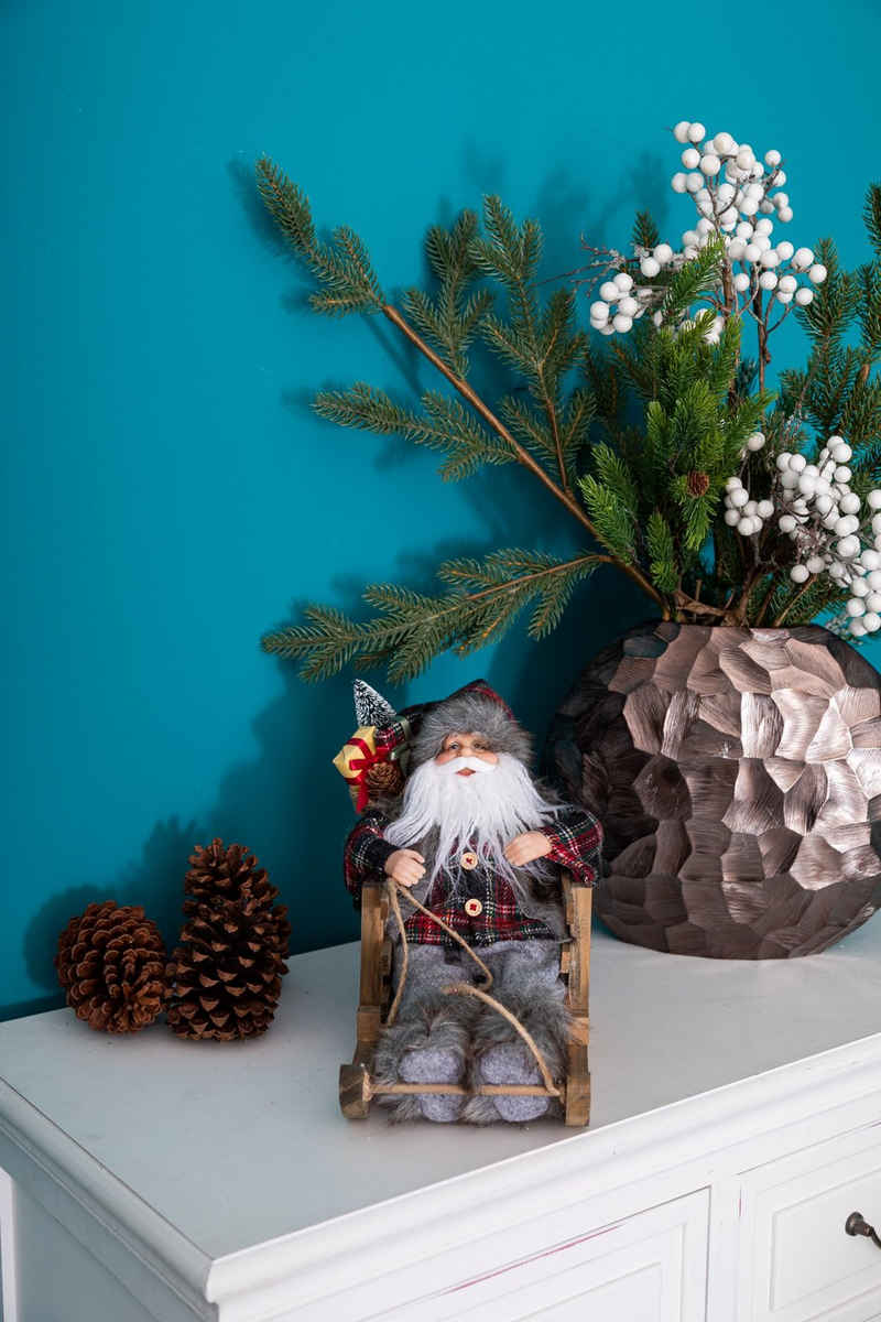 Wohnando Dekofigur Weihnachtsmann auf Schlitten, festlicher Santa Claus auf Schlitten