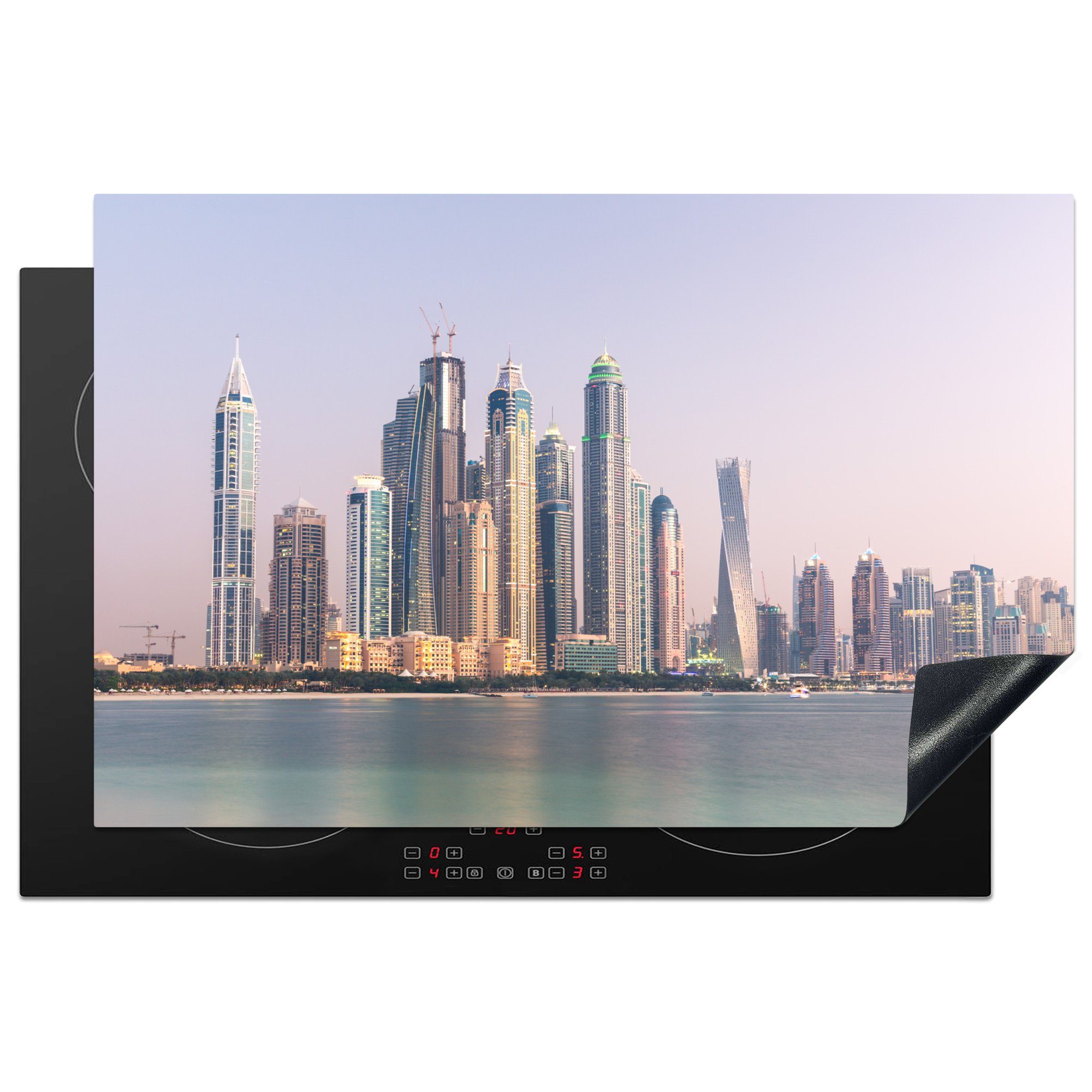 MuchoWow Herdblende-/Abdeckplatte Die Skyline der Wolkenkratzer in Dubai am Meer, Vinyl, (1 tlg), 81x52 cm, Induktionskochfeld Schutz für die küche, Ceranfeldabdeckung