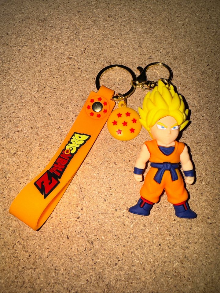 Stelby Schlüsselanhänger Dragonball Songoku Schlüsselanhänger 3D Gummi (Super-Sayajin im Kampfanzug), Strapazierfähiges & flexibles Material für langlebige Nutzung