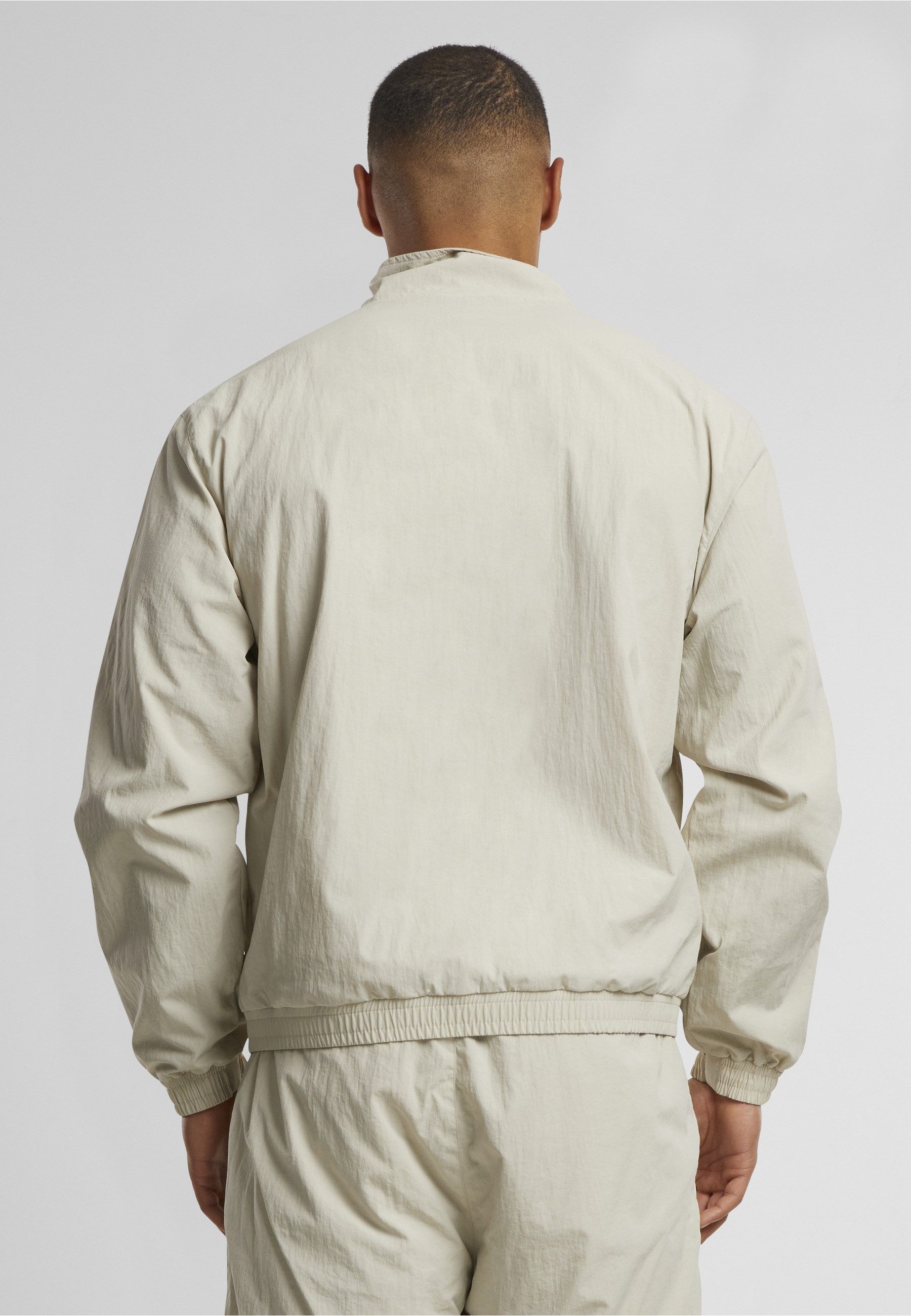 Karl Kani Trainingsjacke Karl Kani Sport Patch Essential Trackjacket (1-St)