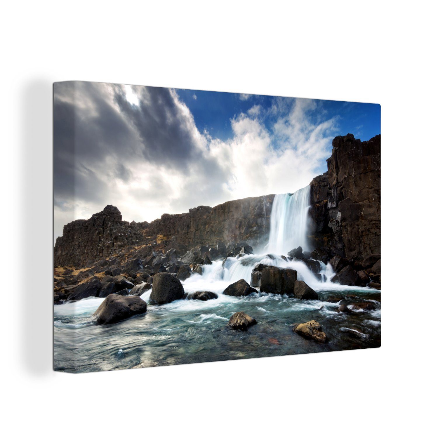 OneMillionCanvasses® Leinwandbild Ein Wasserfall, der in einen Bach im Þingvellir-Nationalpark in Island, (1 St), Wandbild Leinwandbilder, Aufhängefertig, Wanddeko, 30x20 cm