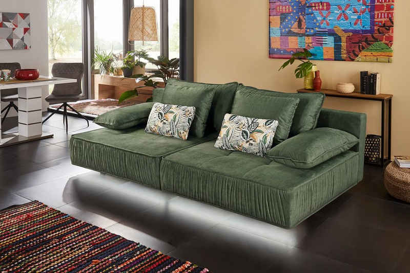 Places of Style Big-Sofa, mit indirekter LED-Ambiente-Beleuchtung, schwebender Optik und künstlerischer Raffung an der vorderen Kante, Federkernpolsterung, frei im Raum stellbar
