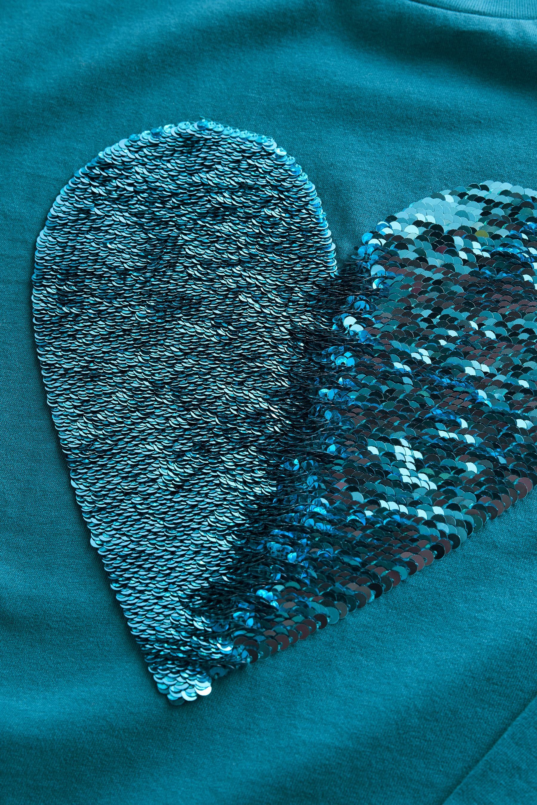 mit Pailletten (1-tlg) Langarmshirt Herzmotiv T-Shirt Teal Blue Langärmeliges Next aus