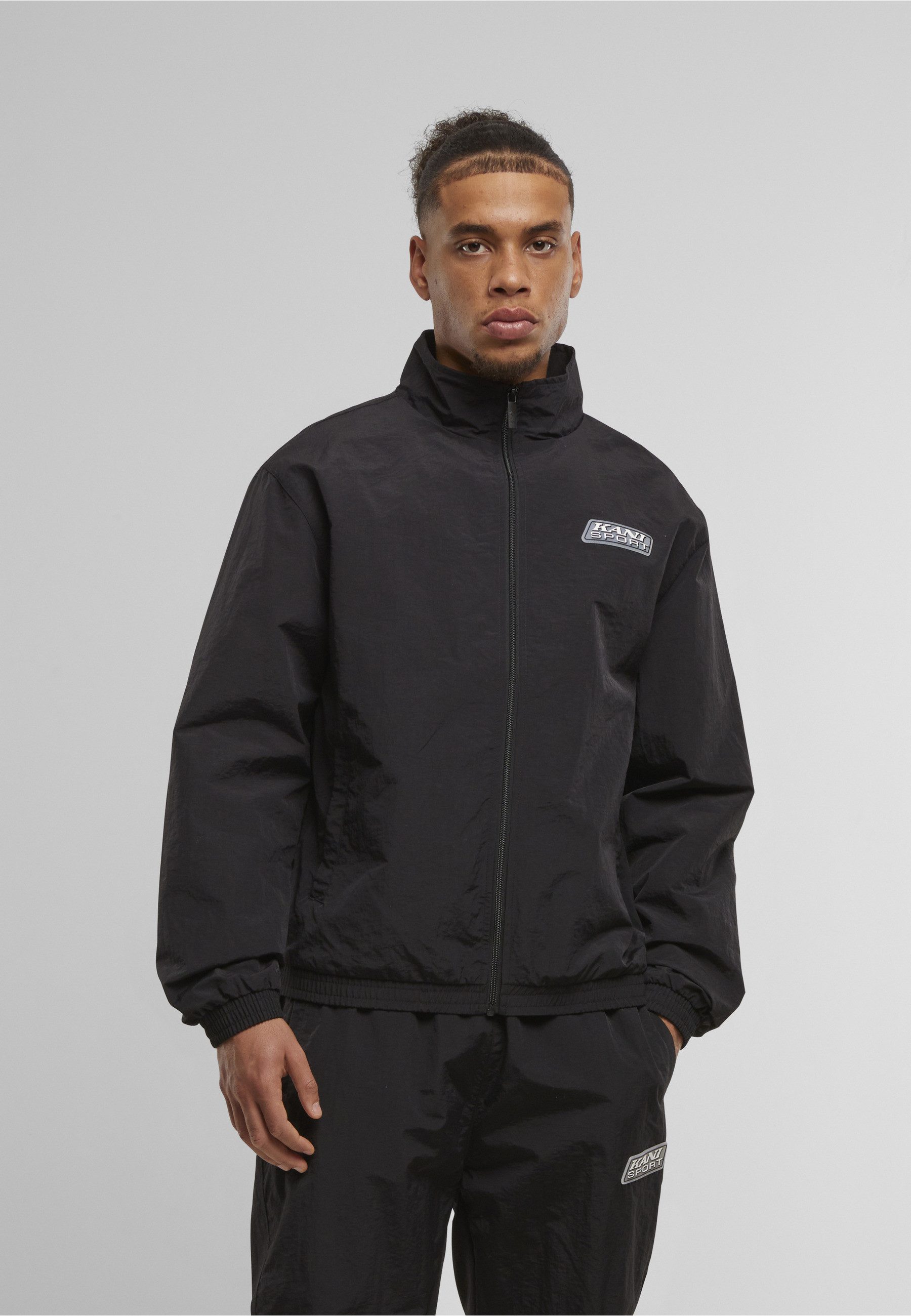 Karl Kani Trainingsjacke Karl Kani Sport Patch Essential Trackjacket (1-St)
