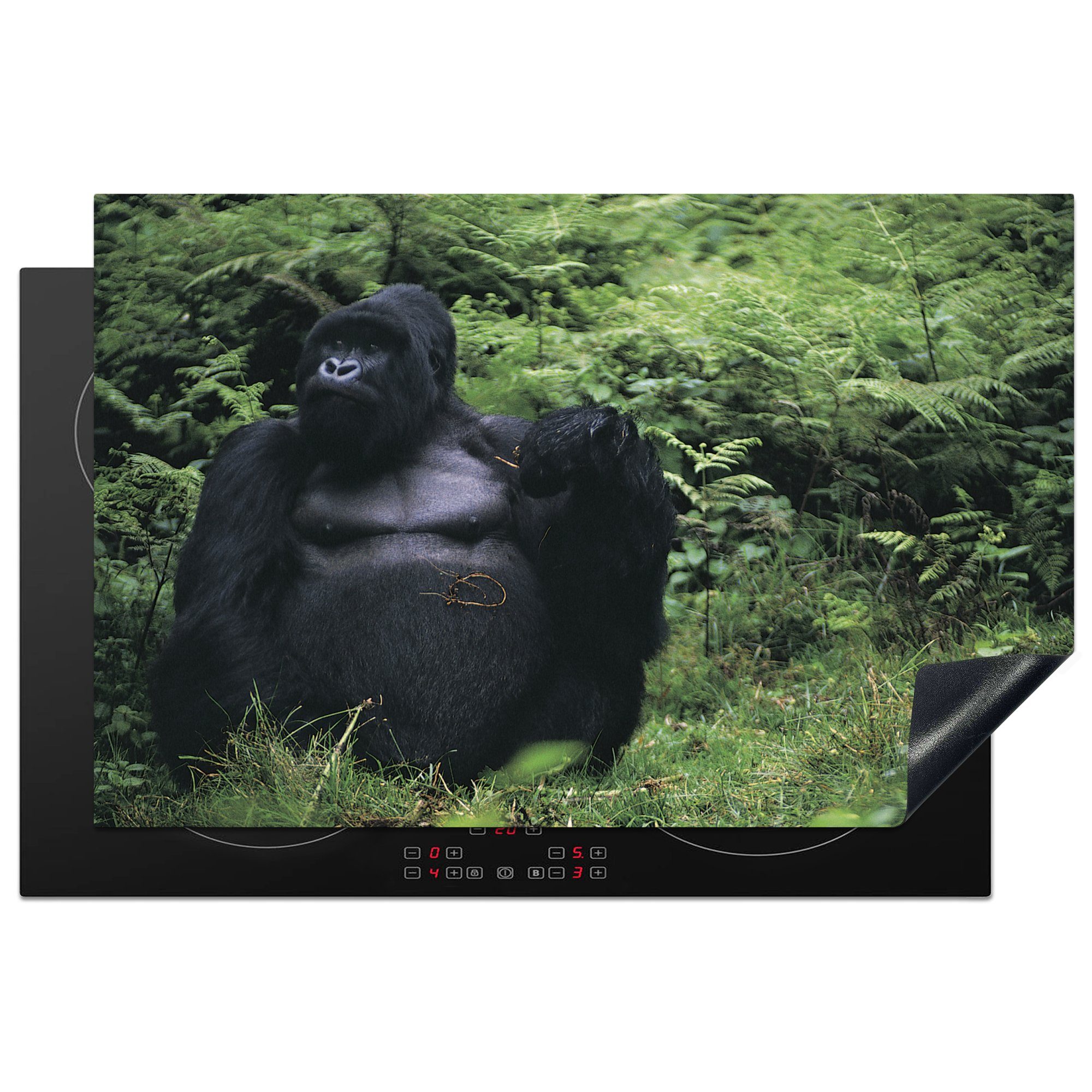 MuchoWow Herdblende-/Abdeckplatte Ein riesiger Gorilla in einem grünen Regenwald, Vinyl, (1 tlg), 81x52 cm, Induktionskochfeld Schutz für die küche, Ceranfeldabdeckung