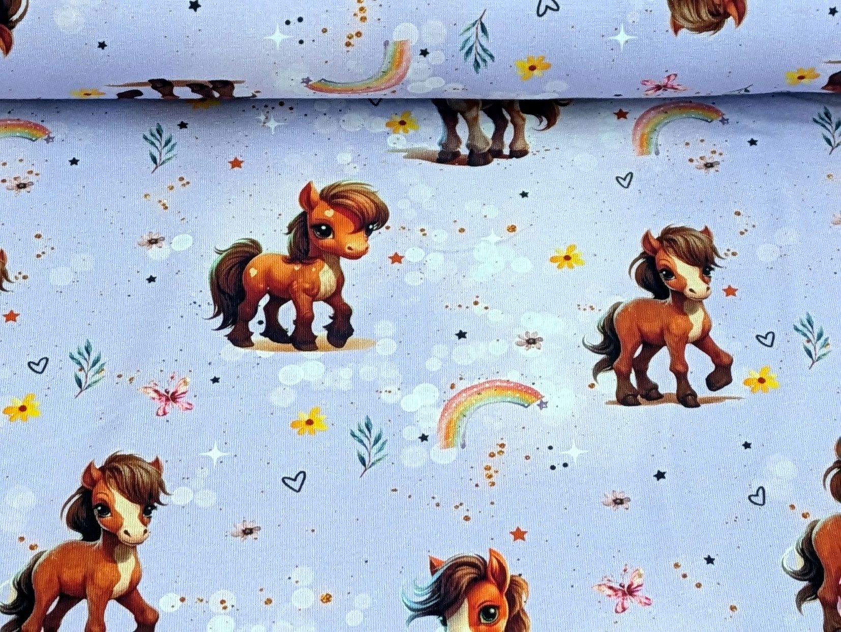 Corileo Stoff Eigenproduktion Baumwolljersey Rainbow Pony auf Flieder Stoff
