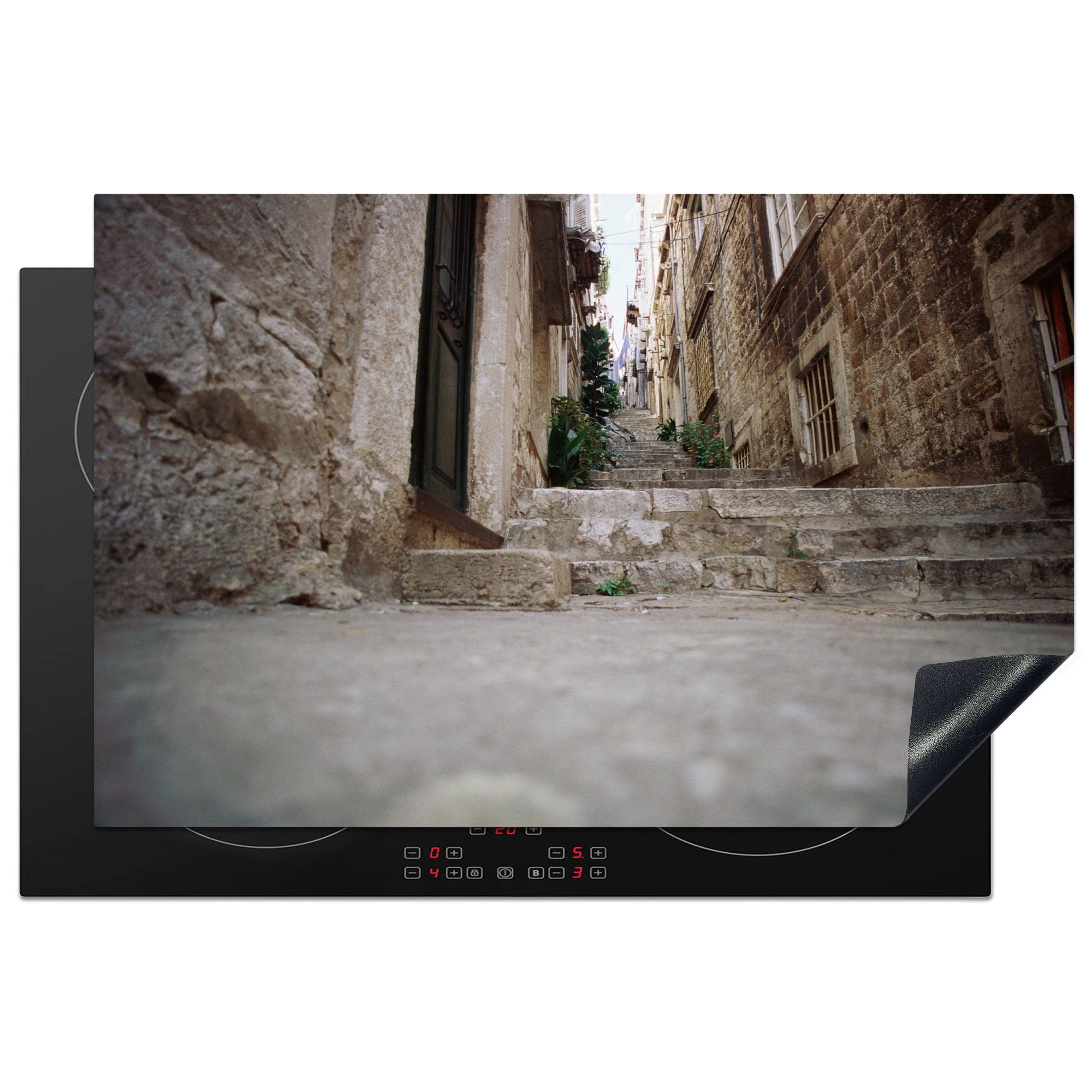 MuchoWow Herdblende-/Abdeckplatte Treppe durch eine Gasse im jugoslawischen Dubrovnik, Vinyl, (1 tlg), 81x52 cm, Induktionskochfeld Schutz für die küche, Ceranfeldabdeckung