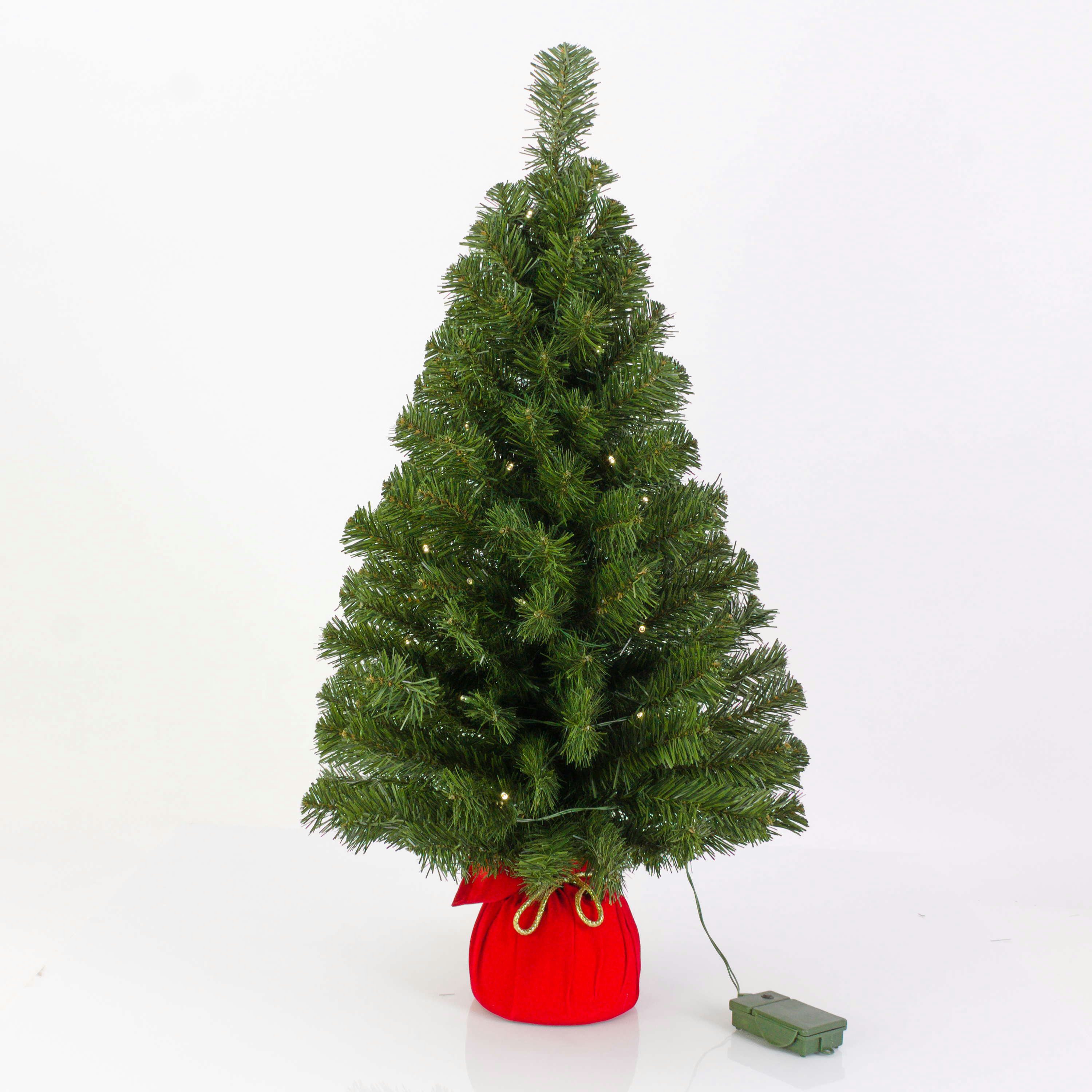 artplants Künstlicher Weihnachtsbaum Deko Tannenbaum WARSCHAU, Jutesack rot, LEDs, 90cm, Ø50cm