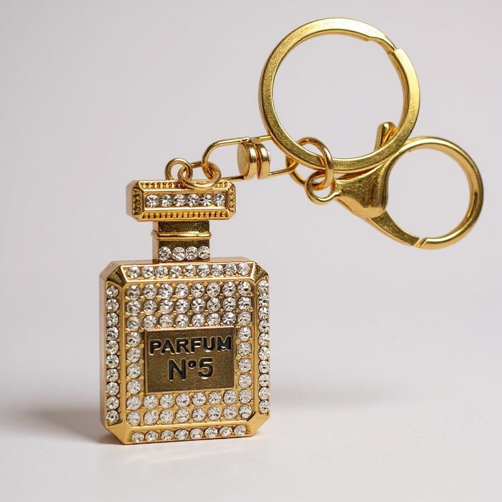 what the shop Schlüsselanhänger Taschenanhänger Parfum Look Gold mit Krista günstig online kaufen
