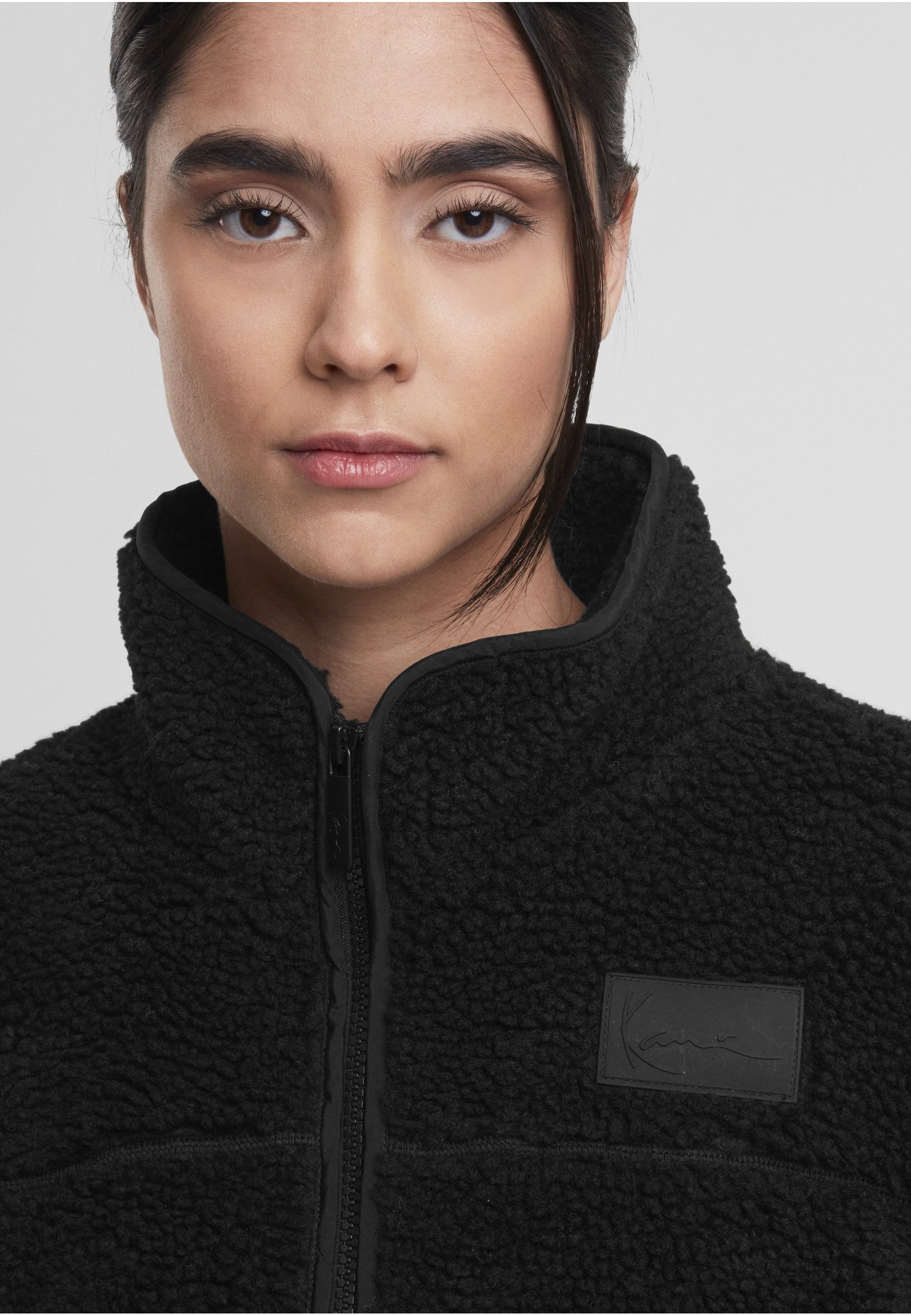 Karl Kani Trainingsjacke Karl Kani Signature Teddy Trackjacket (1-St)