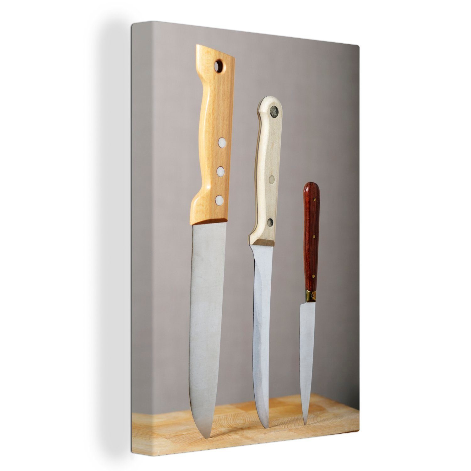 OneMillionCanvasses® Leinwandbild Messer in einem Schneidebrett, (1 St), Leinwandbild fertig bespannt inkl. Zackenaufhänger, Gemälde, 20x30 cm