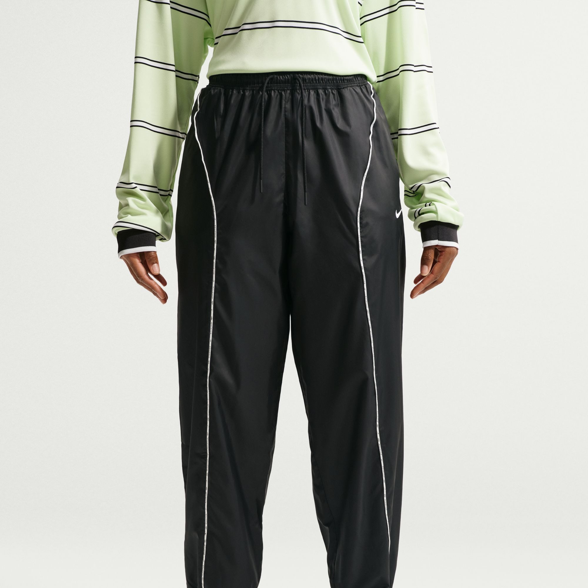 Nike Sportswear Trainingshose Nike Athletics Department Women's Woven Pants in mehreren Größen erhältlich