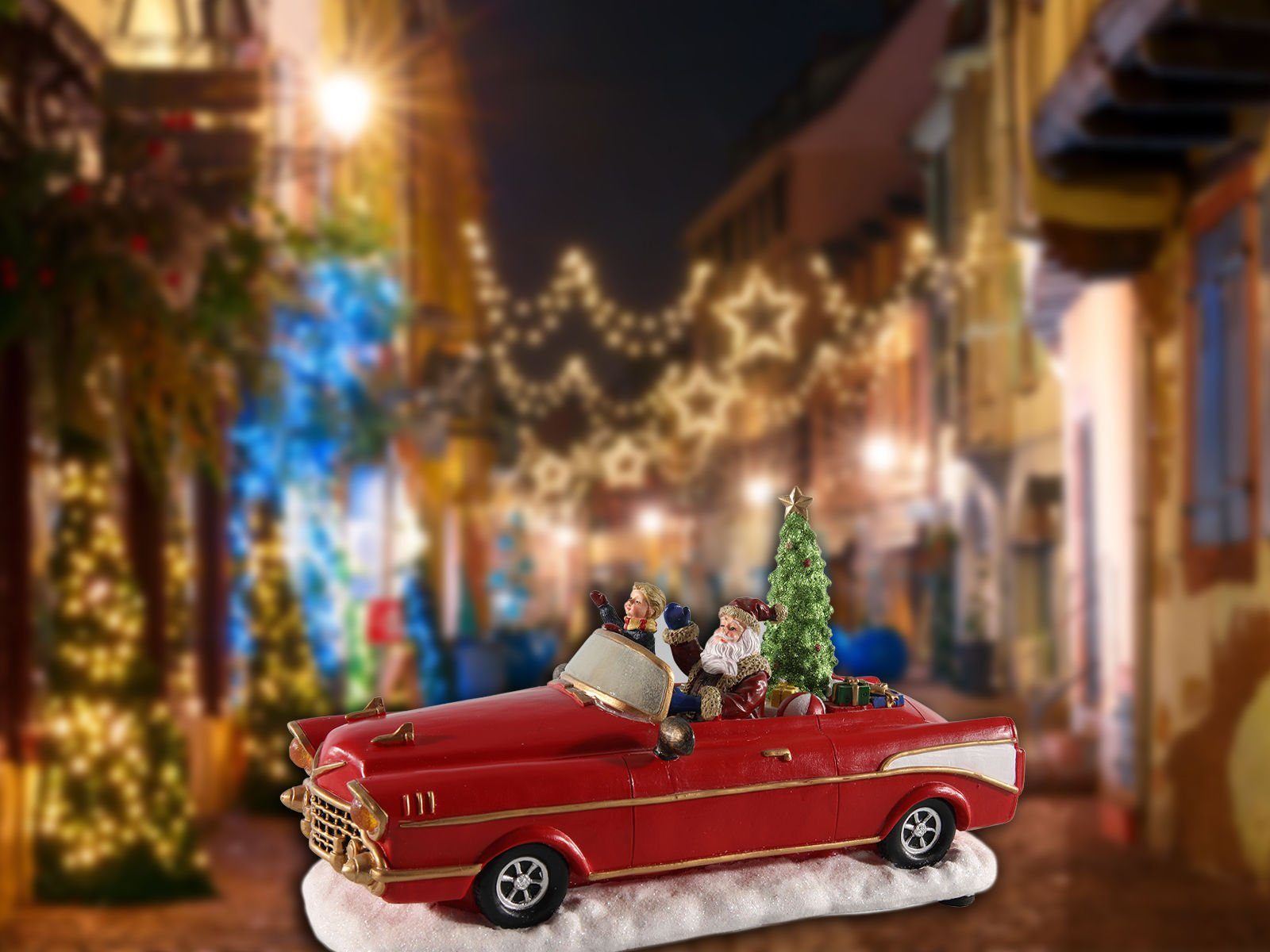 Spetebo Weihnachtsmann Weihnachts Szene Weihnachtsmann im Oldtimer rot, Tisch Deko mit Sound Bewegung und bunter LED Beleuchtung