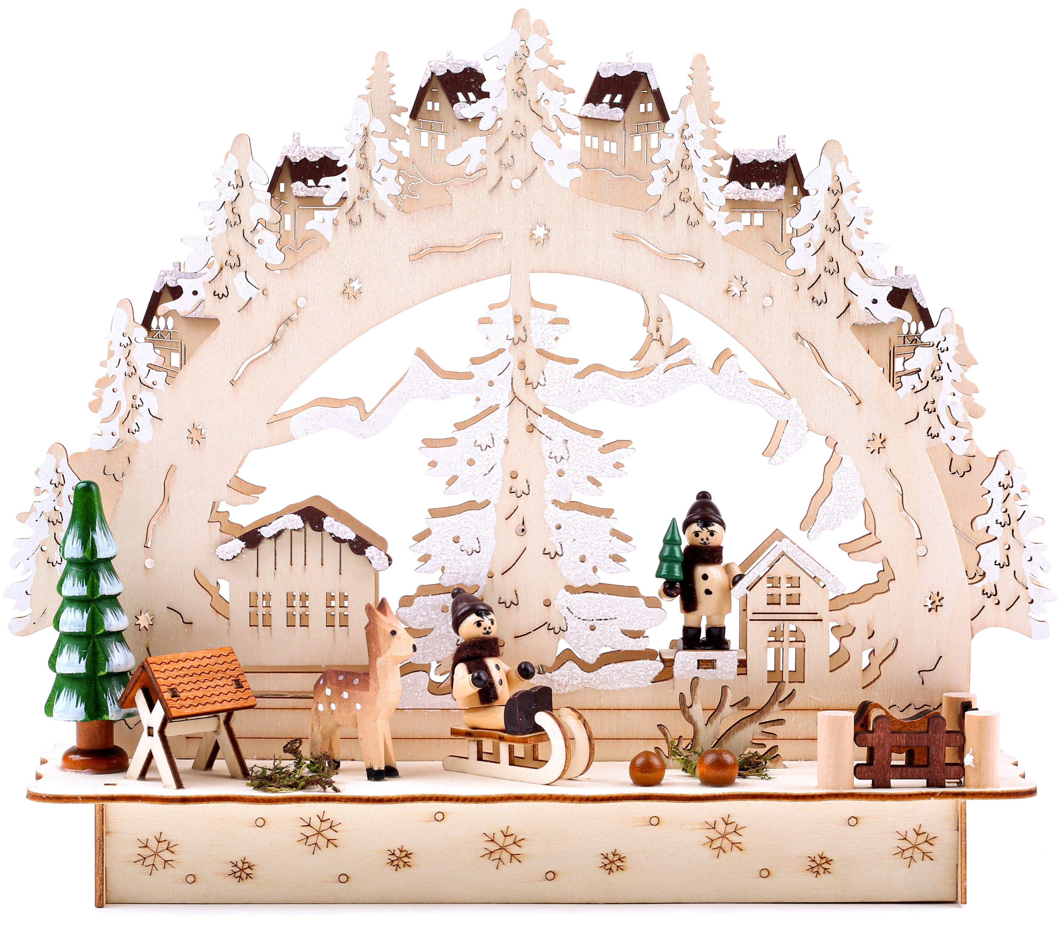 BRUBAKER LED Lichterbogen Schwibbogen - Winterlandschaft mit Dorf, traditioneller Holzbogen mit 3D Szene beleuchtet handbemalt 27,5 cm