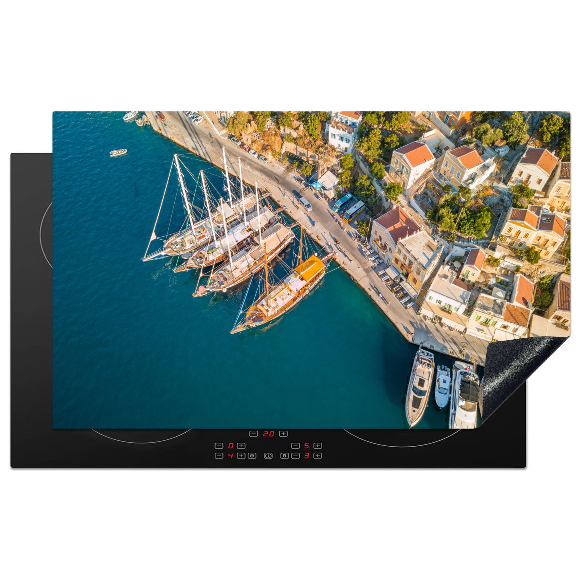 MuchoWow Herdblende-/Abdeckplatte Boote entlang der Küste der griechischen Insel Symi aus der, Vinyl, (1 tlg), 83x51 cm, Ceranfeldabdeckung, Arbeitsplatte für küche