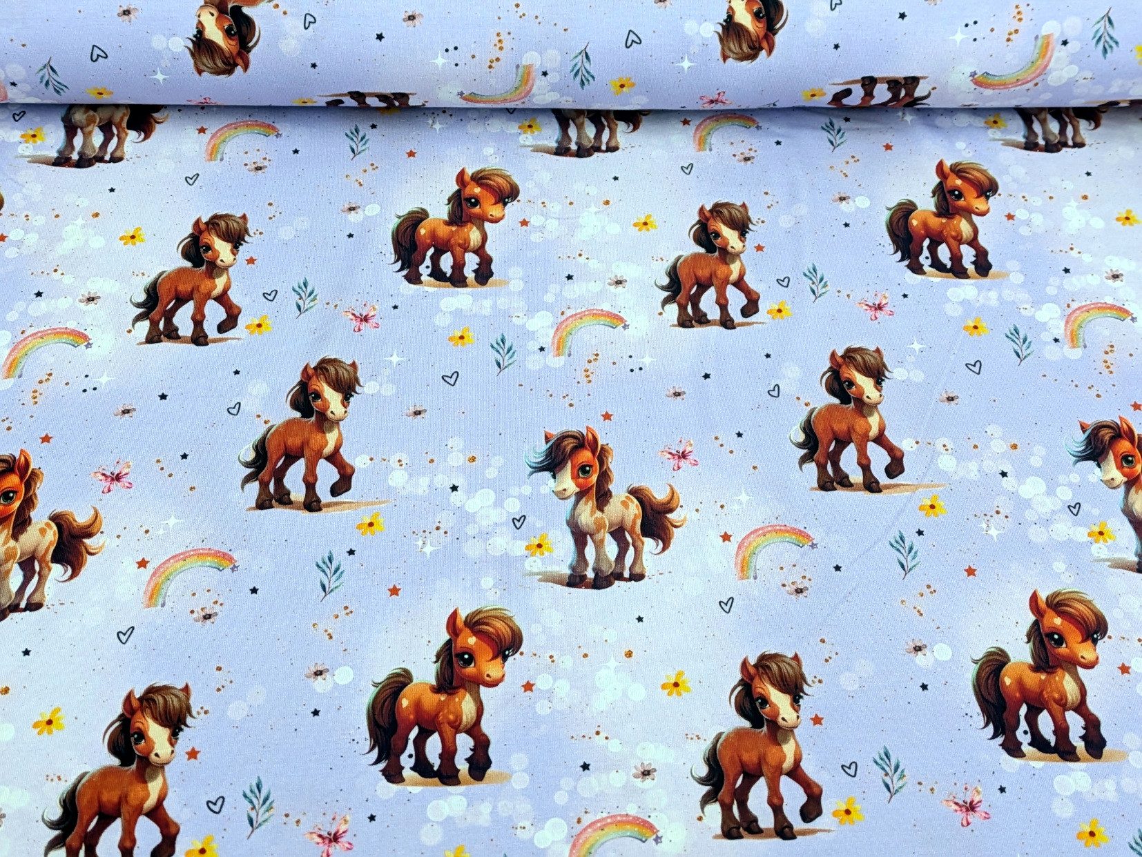 Corileo Stoff Eigenproduktion Baumwolljersey Rainbow Pony auf Flieder Stoff