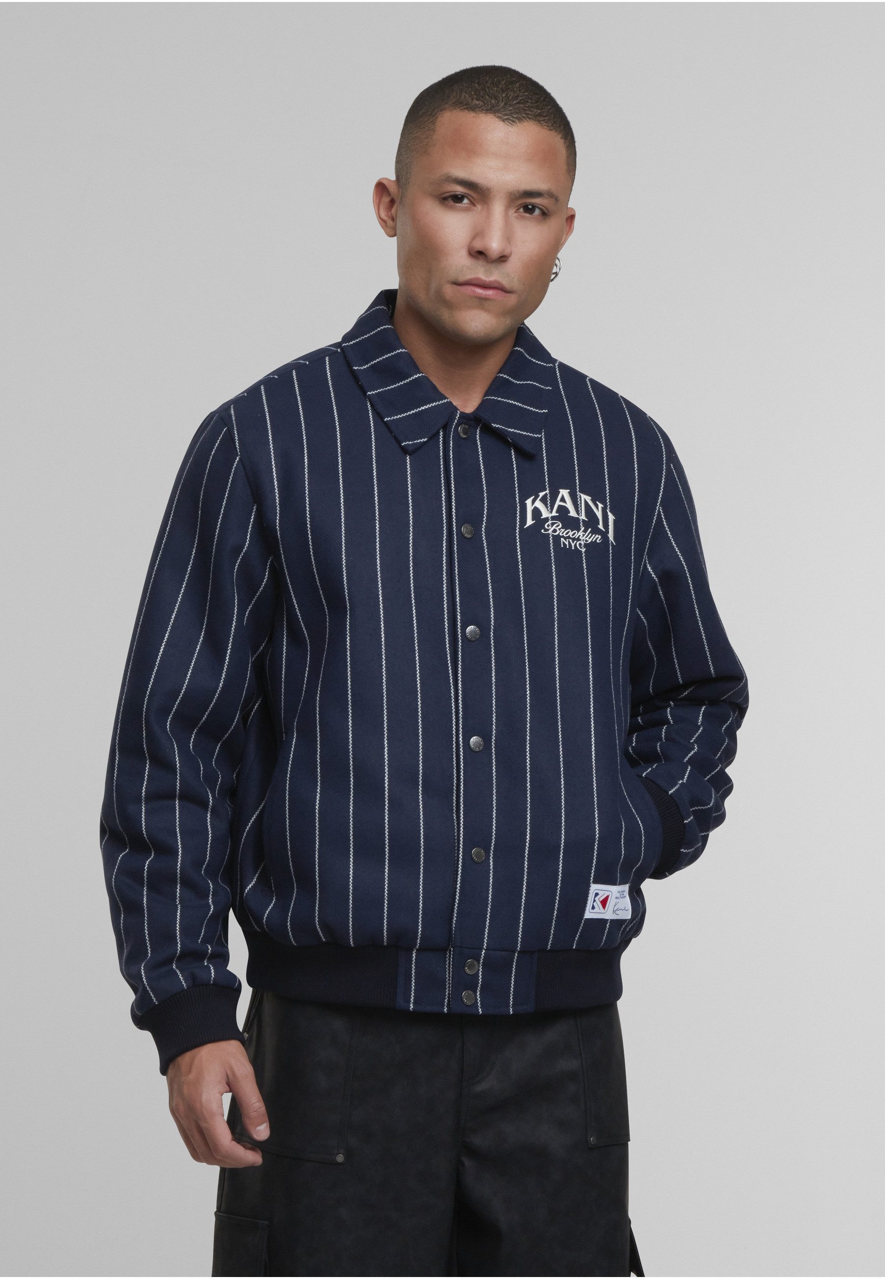 Karl Kani Winterjacke Karl Kani Kani Pinstripes Wool Jacket (1-St)