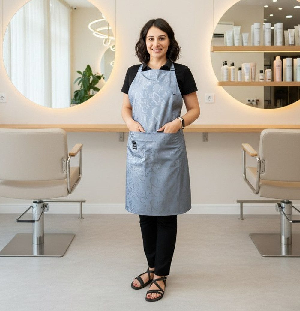 STM Company Kittelschürze Schürze Letters mit Lederdetails & Metallapplikationen, (mit Taschen, für Friseure, Kosmetikerinnen), Trendige Berufsschürze für Friseure & Beauty-Profis