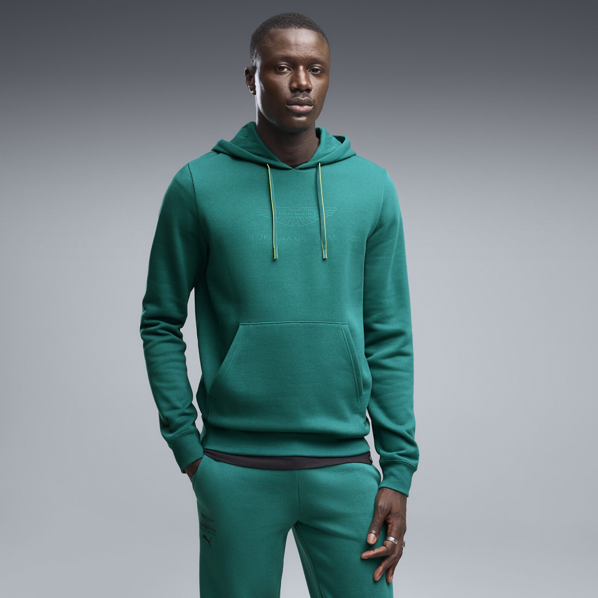 PUMA Hoodie PUMA x ASTON MARTIN ARAMCO F1® TEAM Essentials Hoodie Herren