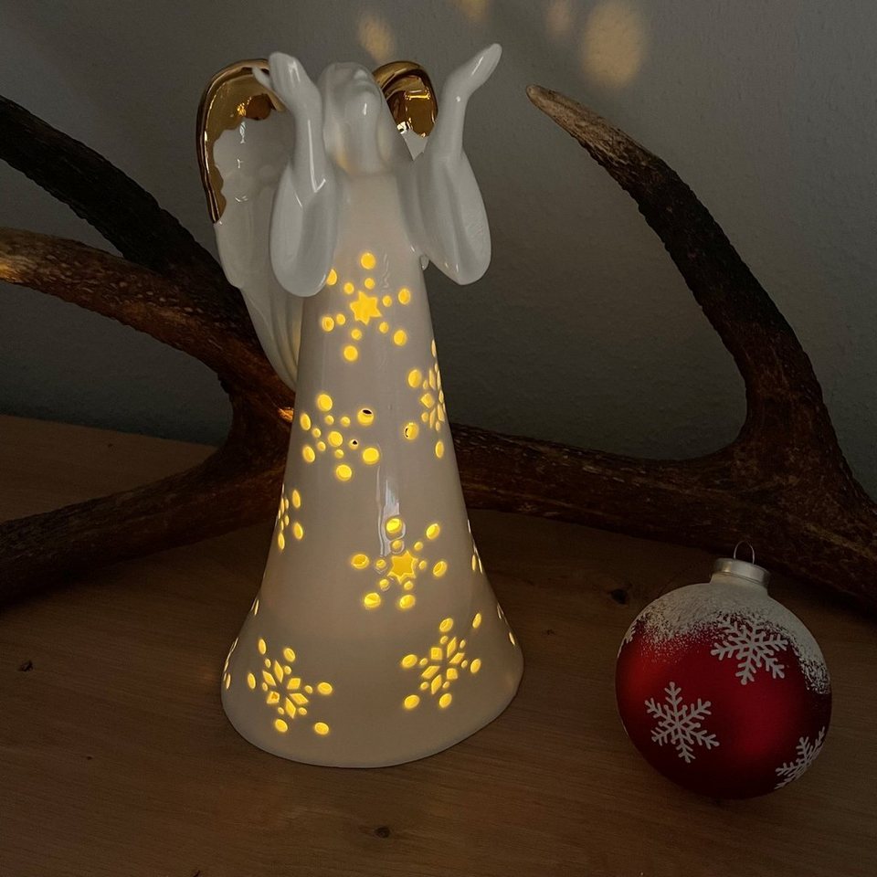 Online-Fuchs LED Dekoobjekt als Engel warmweiß, an aus integriert, den 26x13x12 Maße: mit Keramik glänzend, Gold LED & Beleuchtung 272, LED Timer Flügeln, cm, fest Schneeflocken Weihnachtsdeko