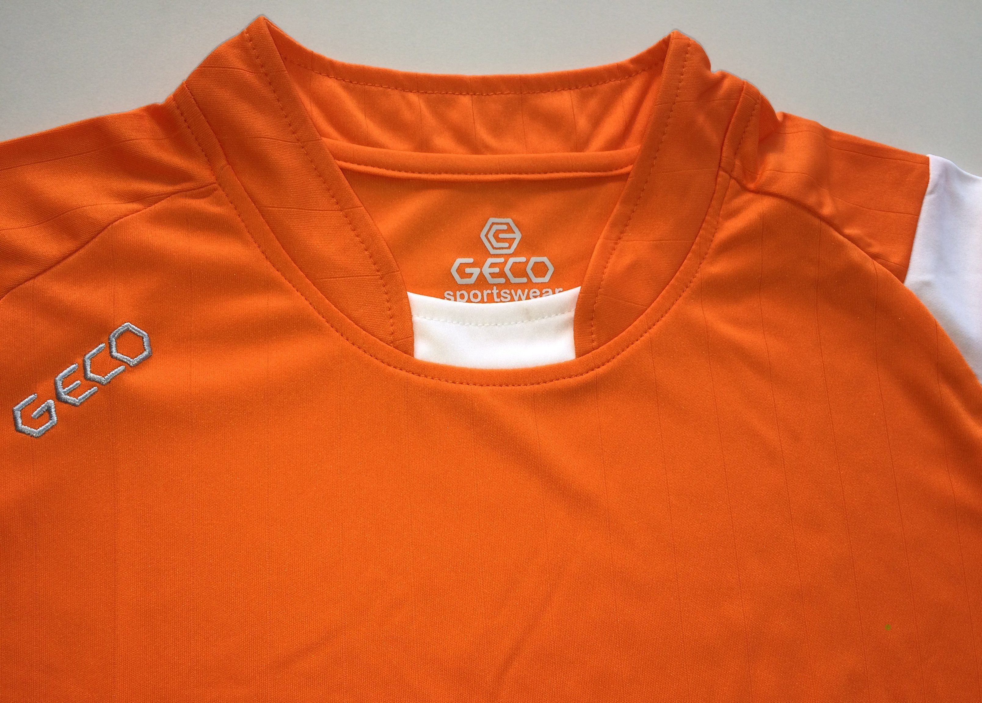 seitliche Fußball Fußballtrikot Trikot Mesheinsätze Geco orange/weiß kurzarm Sportswear zweifarbig Fußballtrikot Levante