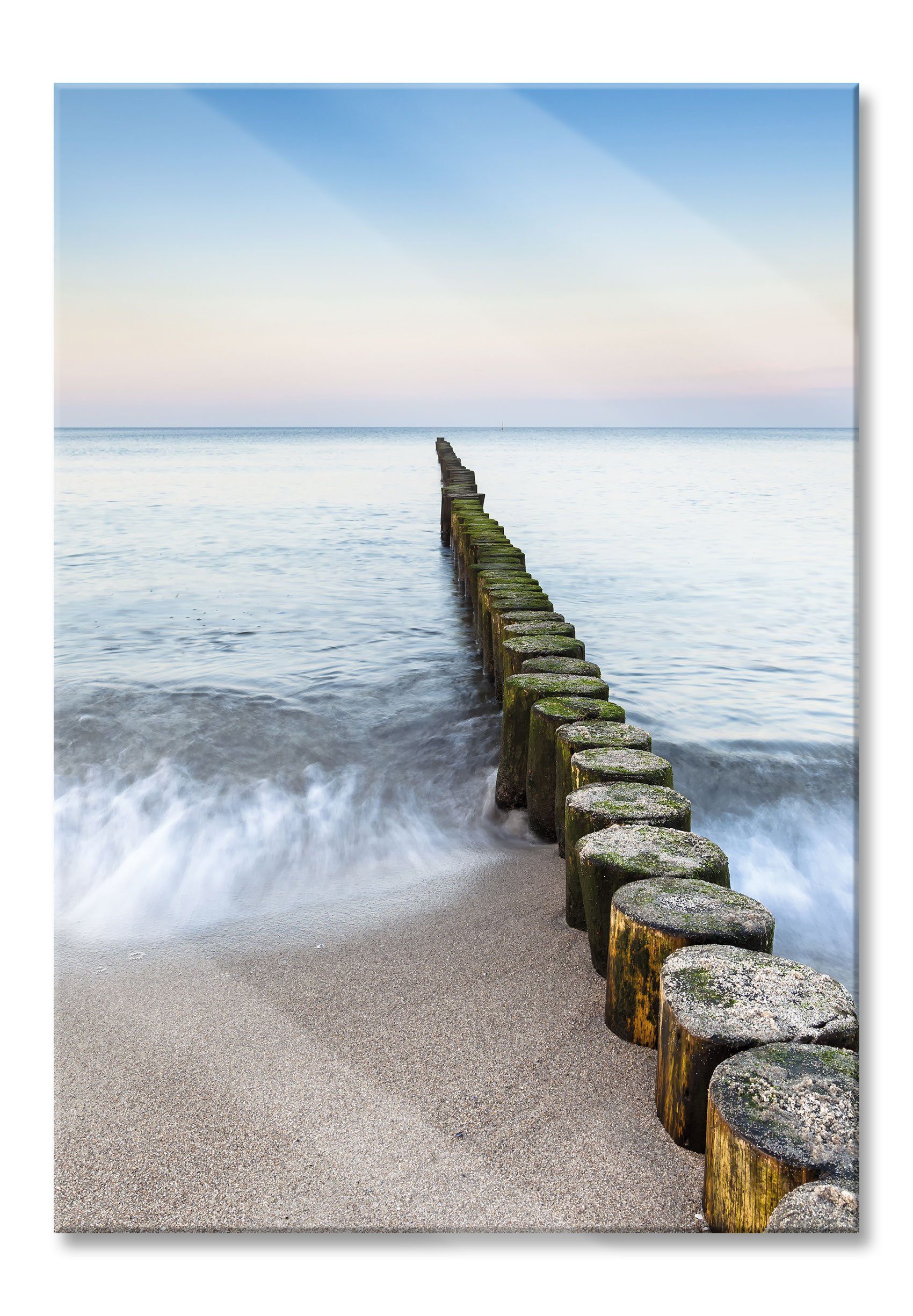 Glasbild Wellenbrecher im Meer