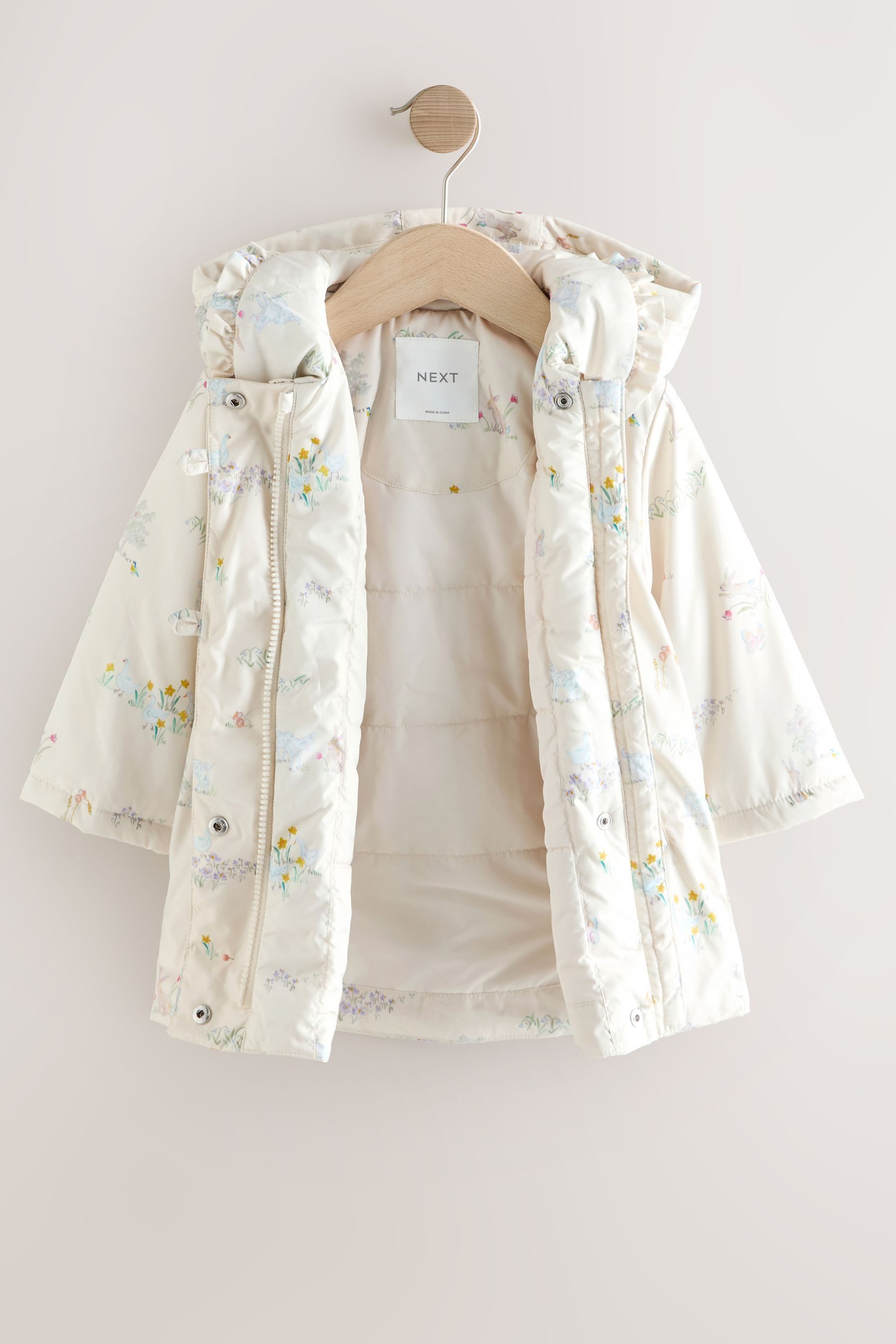 Next Kurzjacke Wasserabweisender Mantel mit Print + Rüschenkragen (1-St)