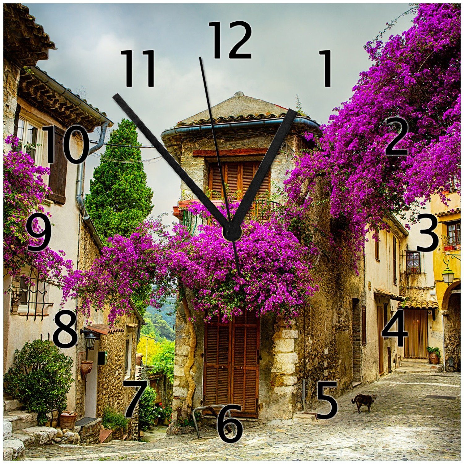 Wallario Wanduhr Malerische Stadt in der Provence mit bunten Blumen (Glasuhr)