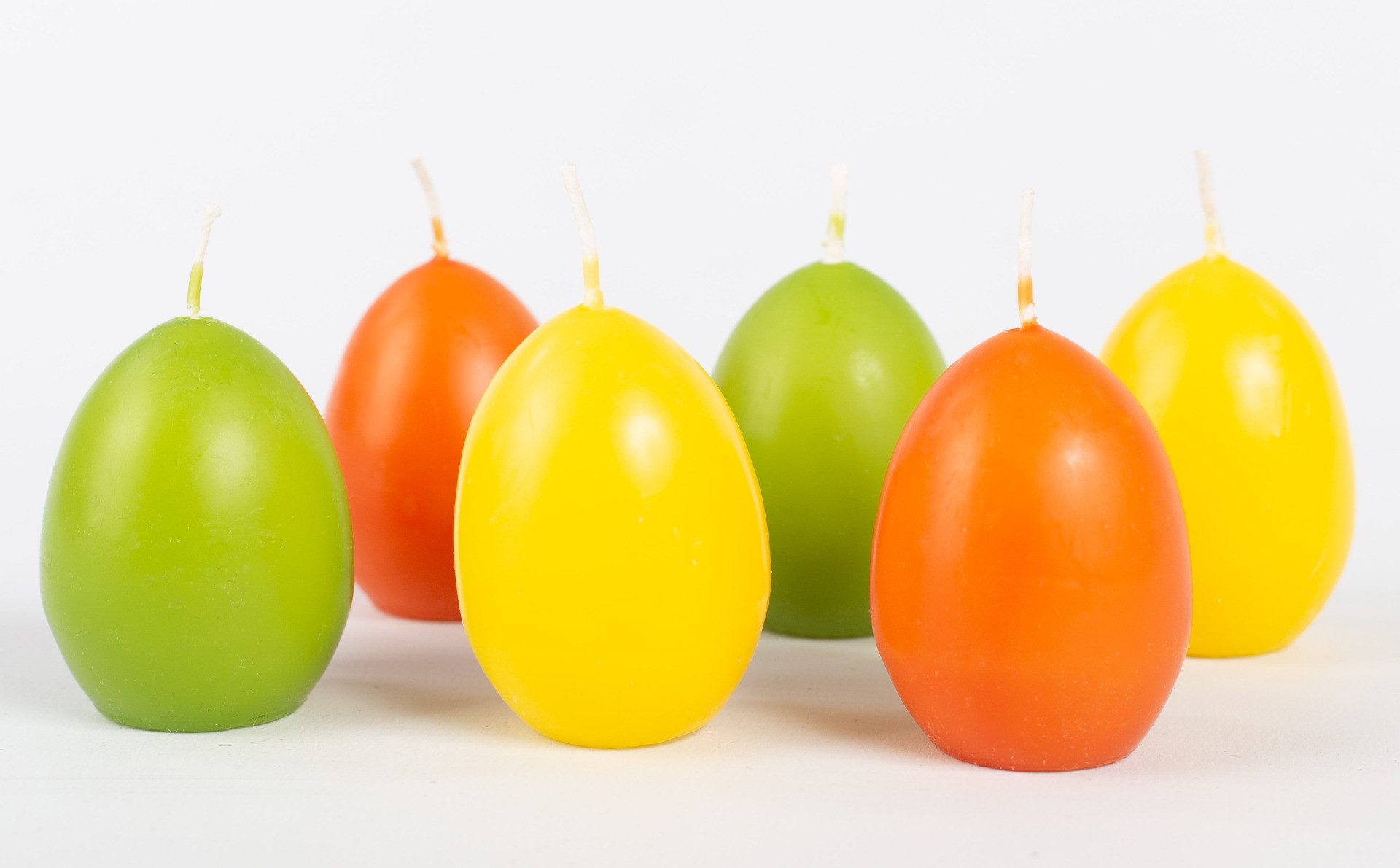 INNA-Glas Formkerze Ostereier Kerzen LEONITA, 6 Stück, gelb-orange-grün, 6cm, 4,5cm, 7h