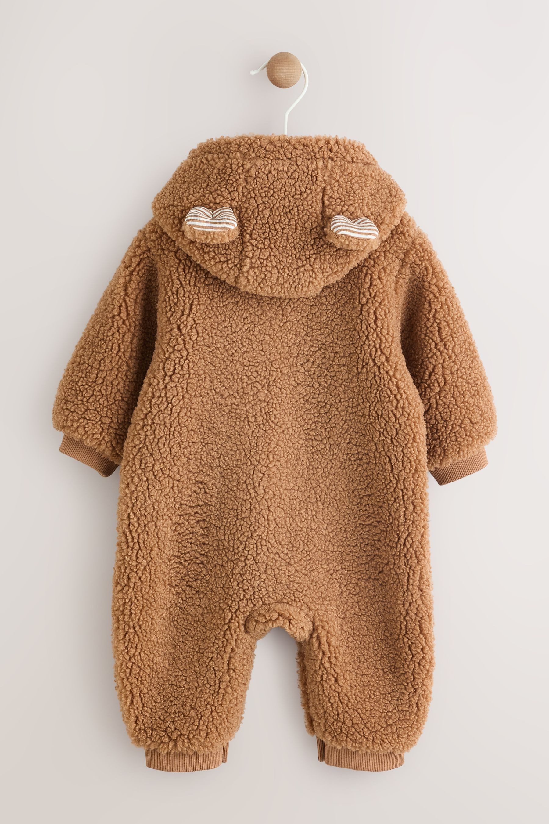 Next Plüschoverall Baby-Strampler mit Kapuze aus Borg (1-tlg)