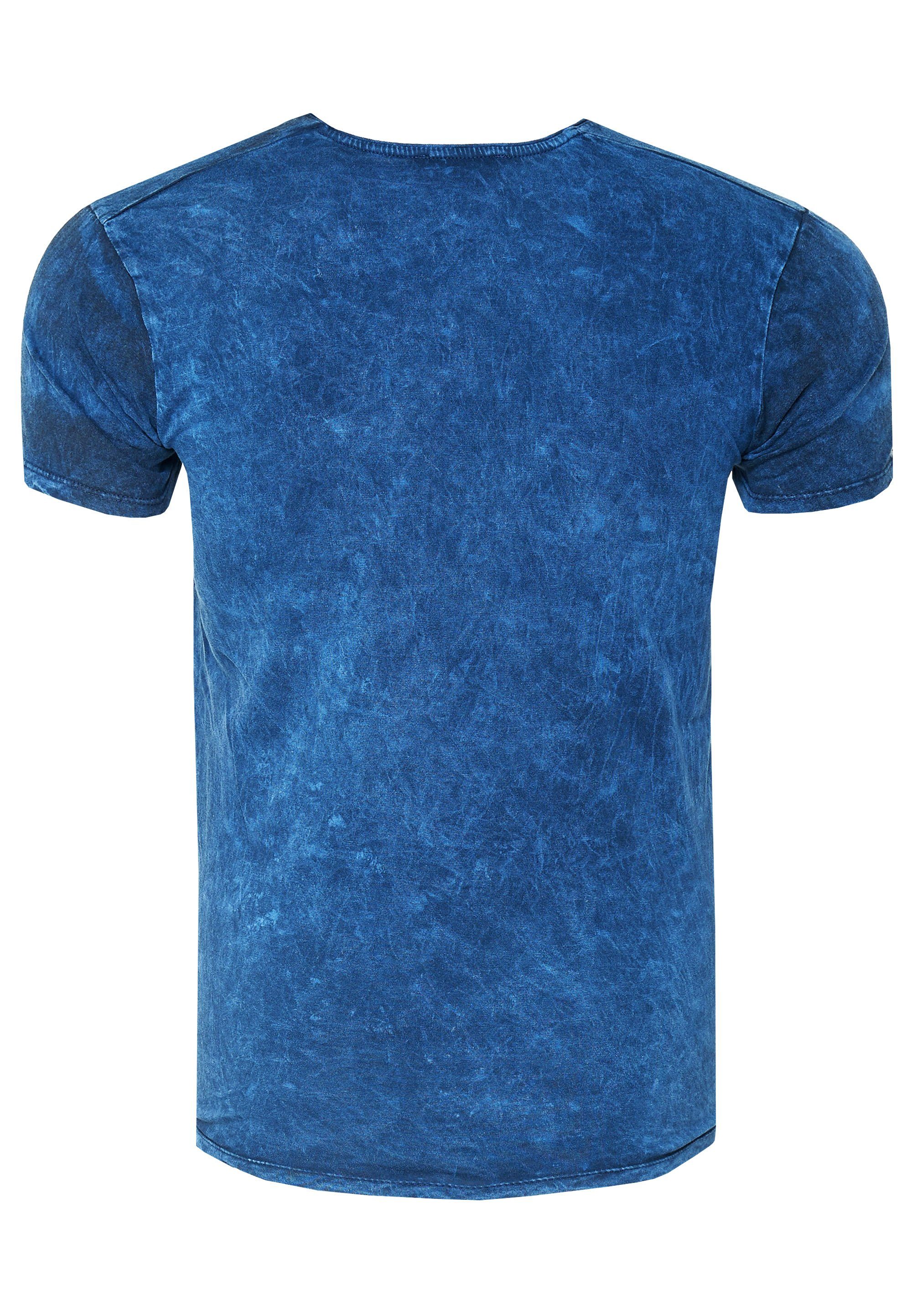 Rusty Neal Print mit blau T-Shirt eindrucksvollem