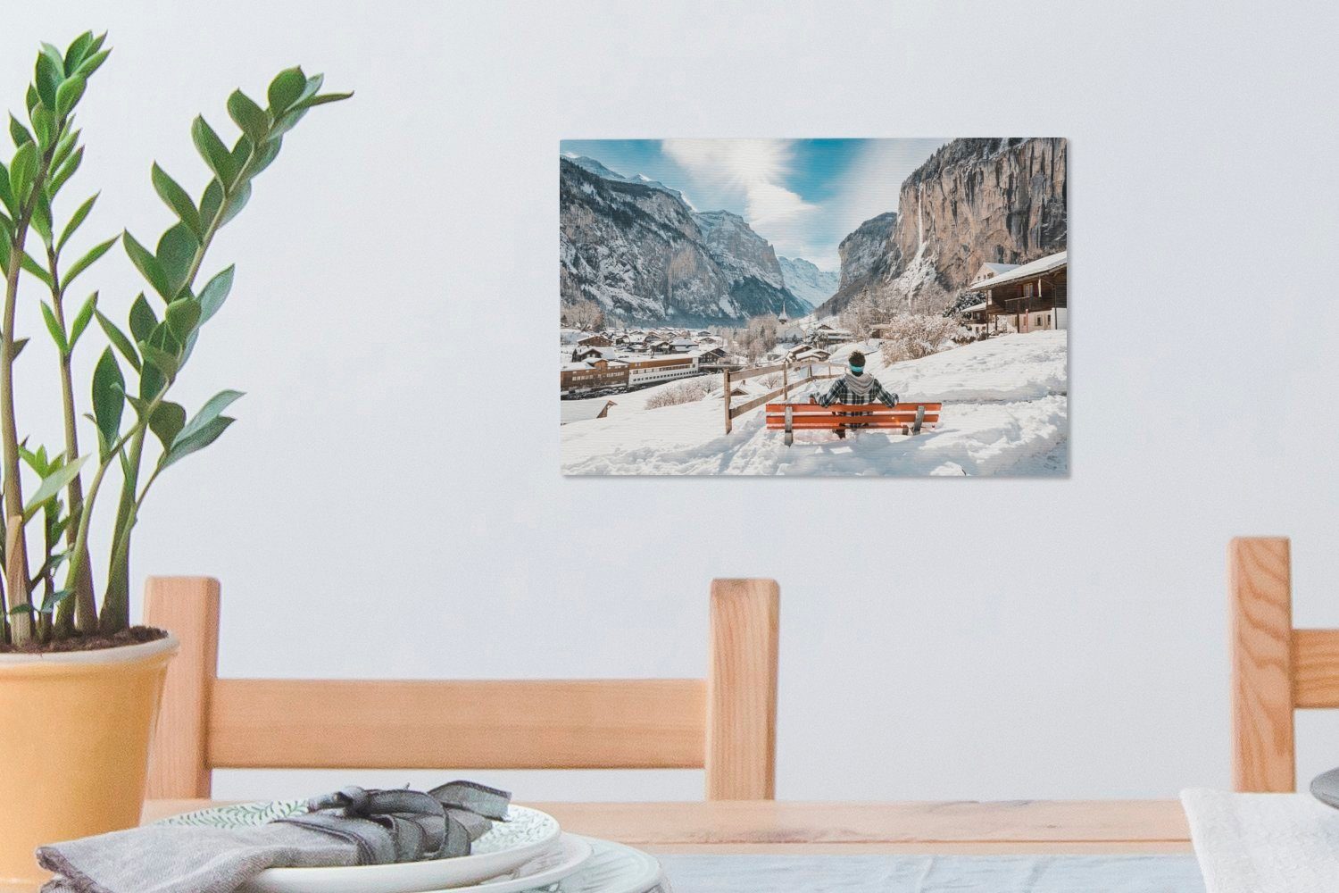 Schweiz, auf 30x20 (1 Wanddeko, der Mann in Wandbild cm Aufhängefertig, Bank im OneMillionCanvasses® Leinwandbilder, St), Winter einer Leinwandbild