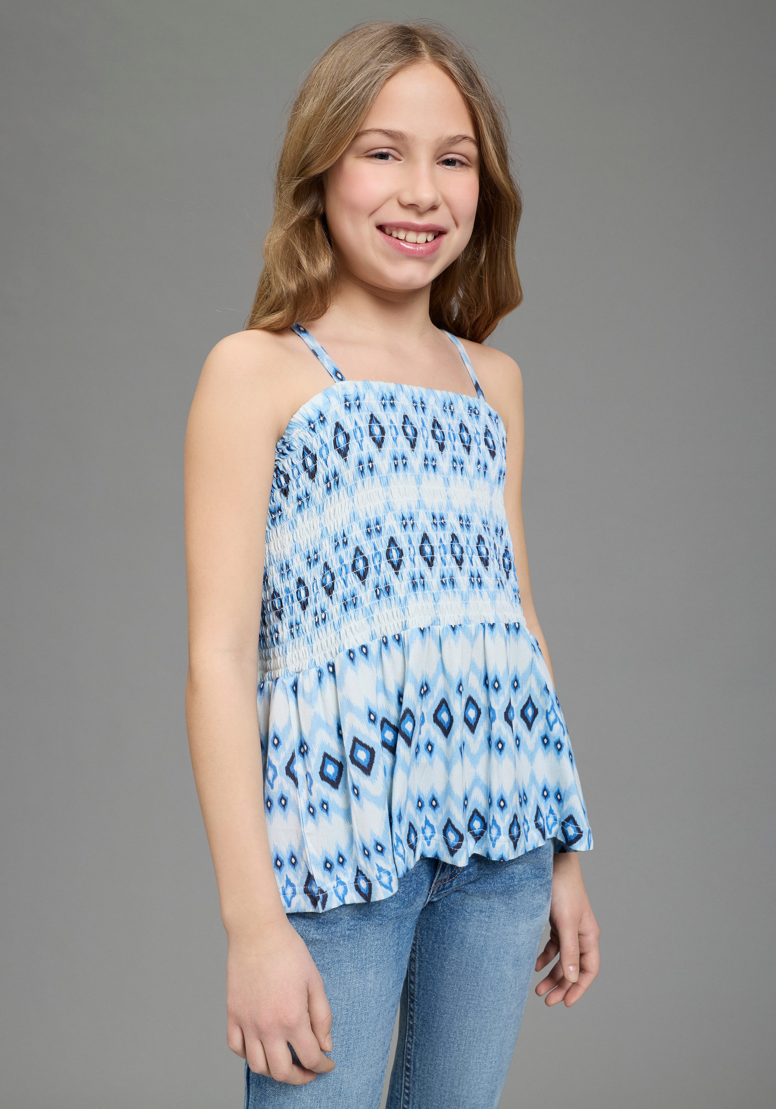 KangaROOS T-Shirt Kangaroos Smoke Top für Mädchen eng anliegende Passform, ärmellos, bedruckte Optik. € 24,99, (€ 24,99 pro 1 Stk).