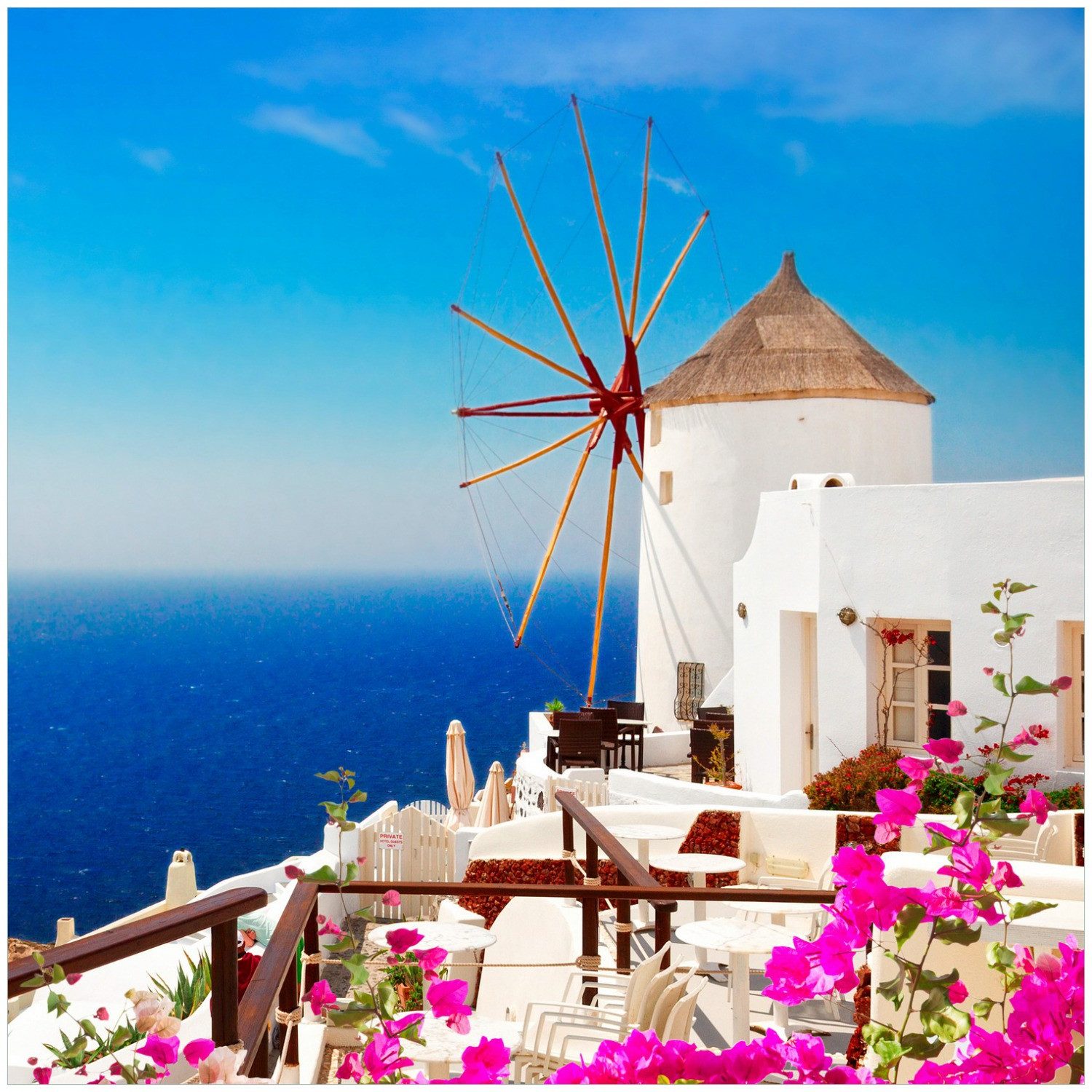 Wallario Möbelfolie Windmühle über azurblauem Meer