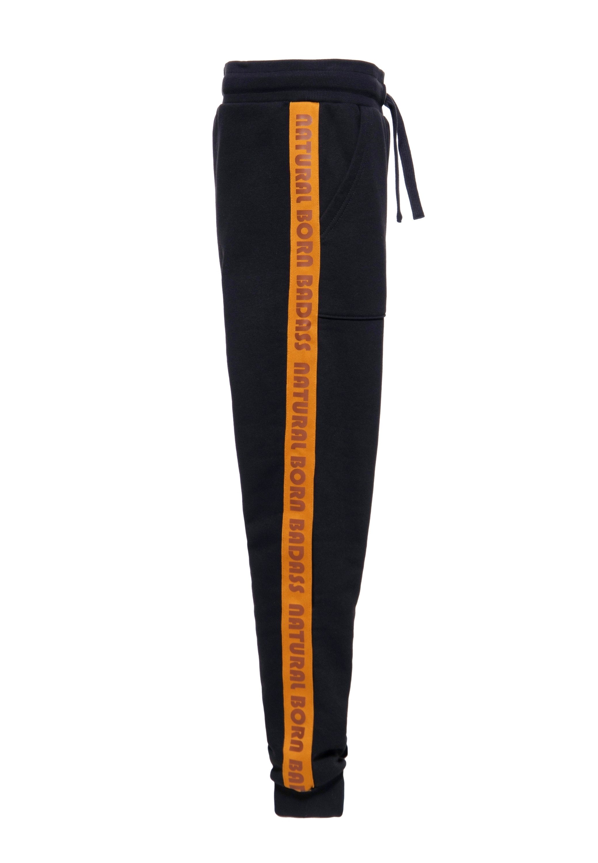 KingKerosin Jogginghose Natural Born Badass mit Schriftzug seitlich