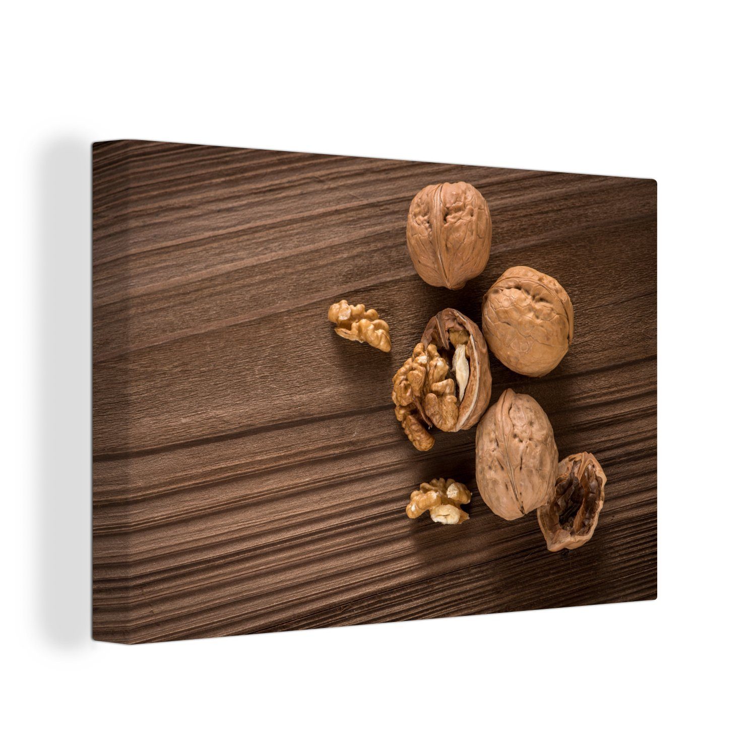 OneMillionCanvasses® Leinwandbild Gerissenes Nussbaumholz auf einem dunkelbraunen Tisch, (1 St), Wandbild Leinwandbilder, Aufhängefertig, Wanddeko, 30x20 cm