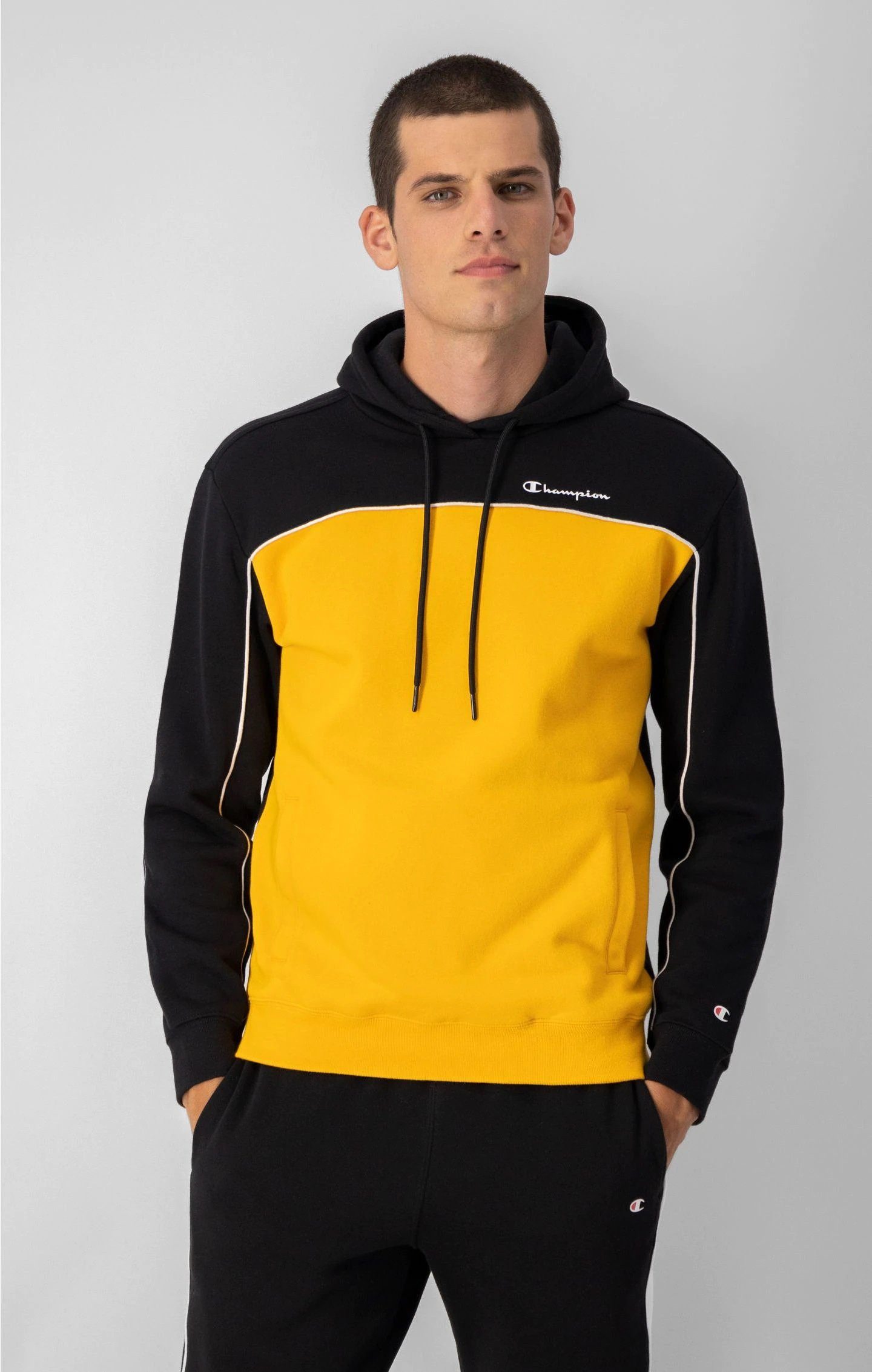 Champion Kapuzenpullover (Hoodie) aus Baumwollfleece in Farbblockoptik gelb/schwarz Herren
