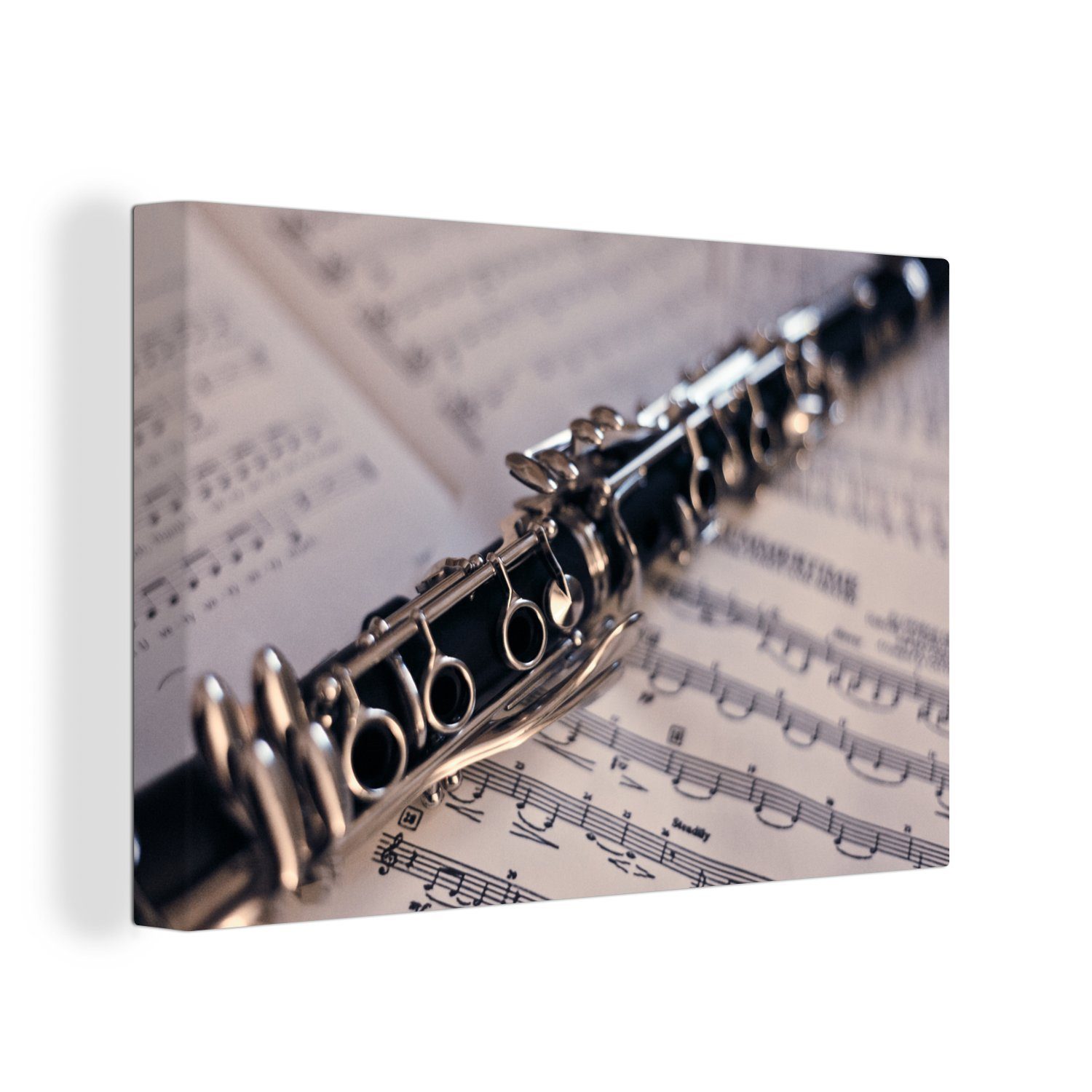 OneMillionCanvasses® Leinwandbild Klarinette auf verschiedenen Notenblättern, (1 St), Wandbild Leinwandbilder, Aufhängefertig, Wanddeko, 30x20 cm