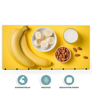 Primedeco Garderobenpaneel Magnetwand und Memoboard aus Glas Bananen ganz und geschnitten
