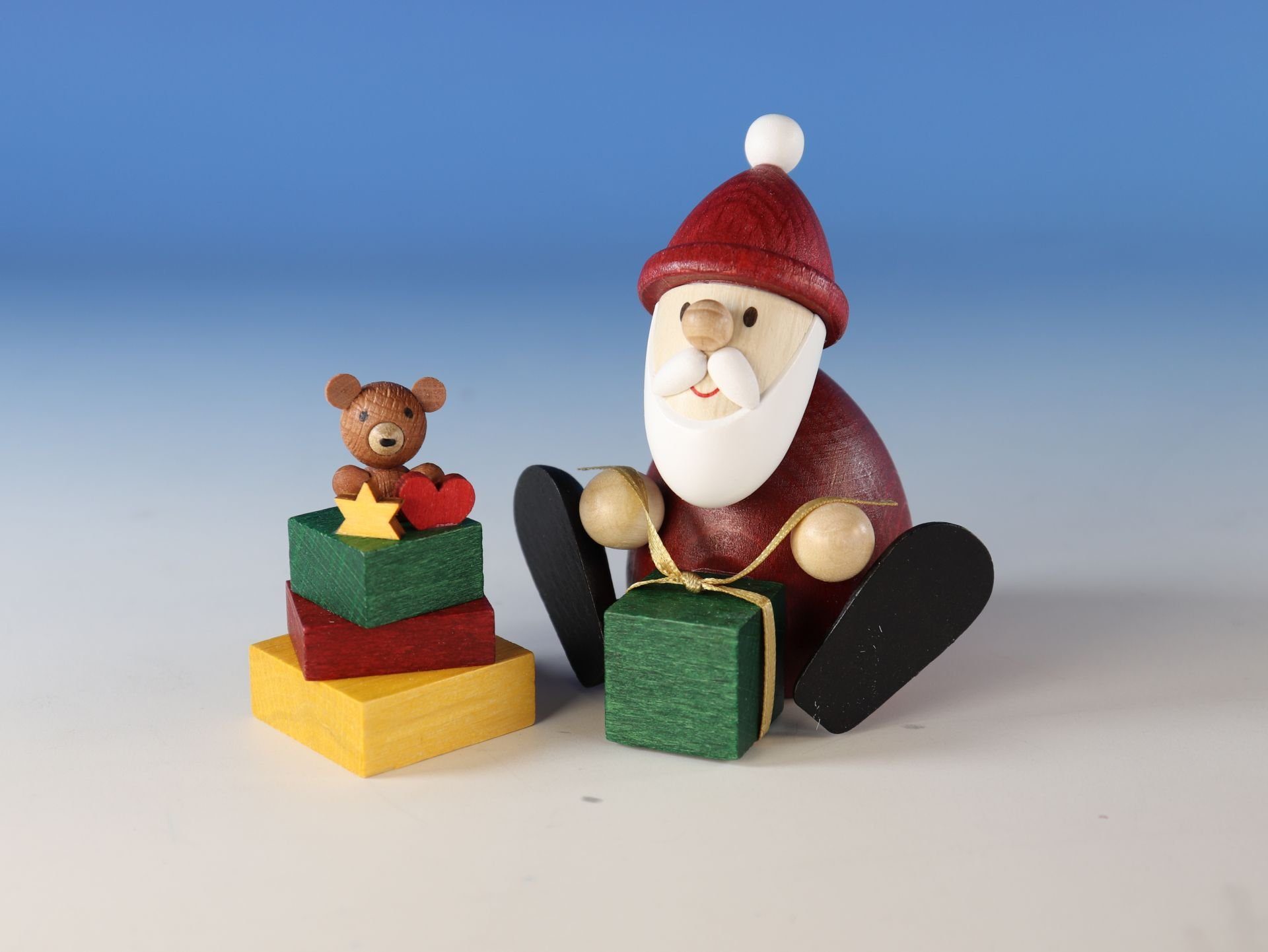 Ullrich Kunsthandwerk Weihnachtsmann Geschenkset Weihnachtsmann mit Geschenkestapel, in Klarsicht Geschenkbox