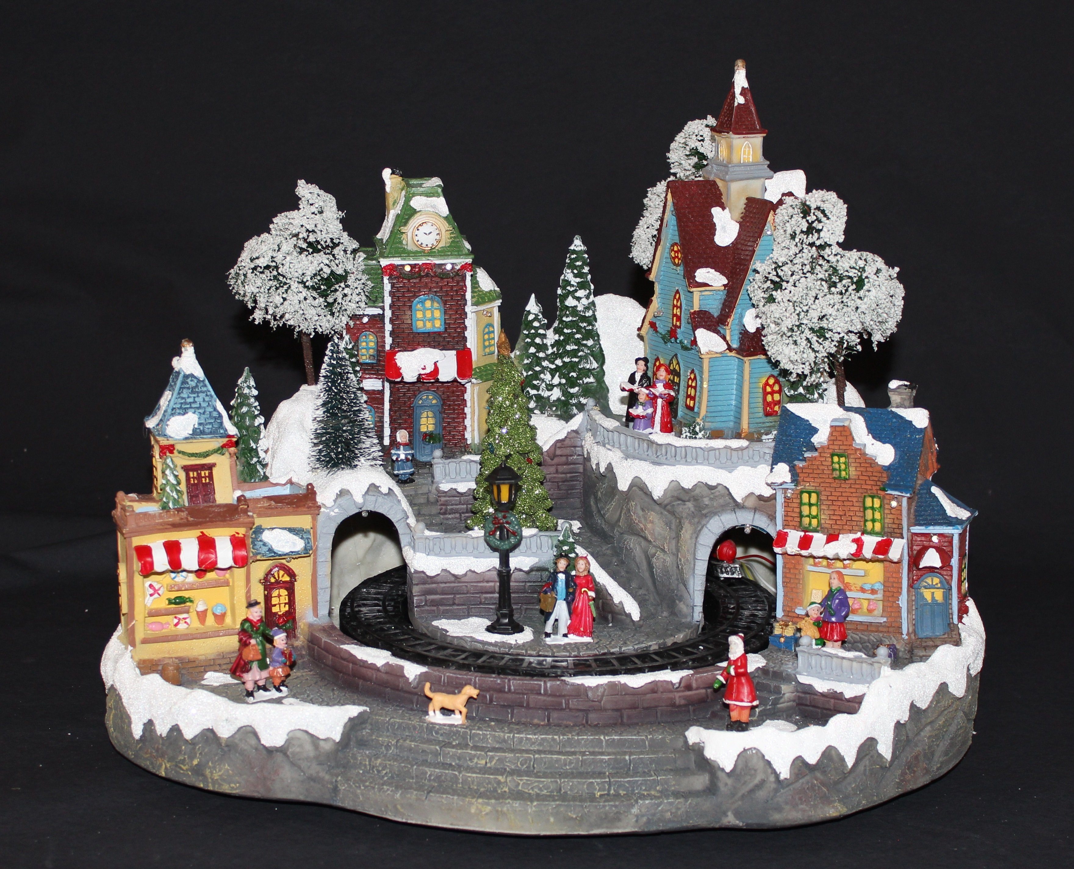 Weihnachtsszene Winterszene Dorf mit fahrendem Zug, Beleuchtung und Musik